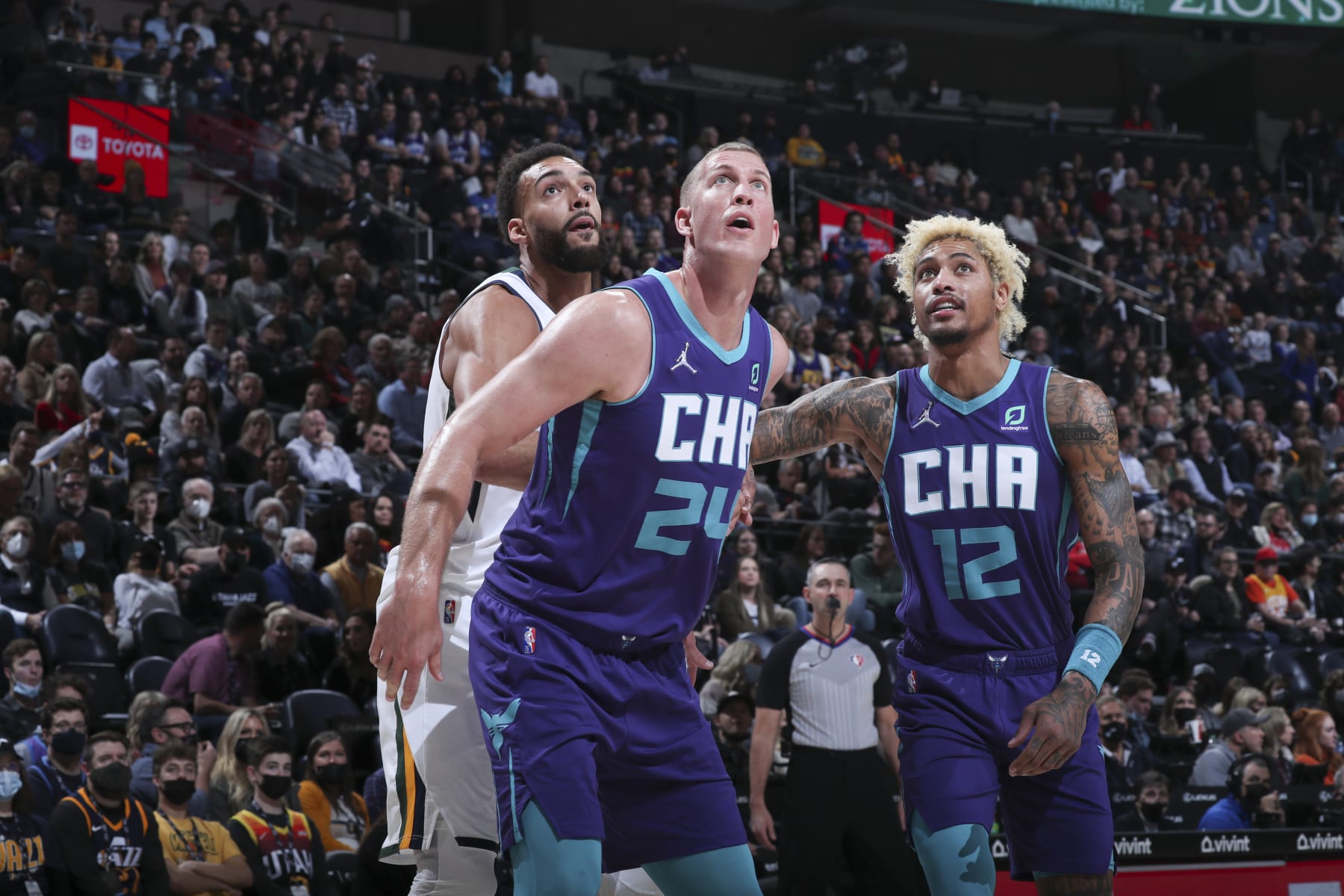 SALT LAKE CITY, UT - DECEMBER 20: Mason Plumlee #24 of the Charlotte Hornets boxes out Rudy Gobert #27 of the Utah Jazz and Kelly Oubre Jr. #12 of the Charlotte Hornets during the game on December 20, 2021 at vivint.SmartHome Arena in Salt Lake City, Utah. NOTE TO USER: User expressly acknowledges and agrees that, by downloading and or using this Photograph, User is consenting to the terms and conditions of the Getty Images License Agreement. Mandatory Copyright Notice: Copyright 2021 NBAE (Photo by Melissa Majchrzak/NBAE via Getty Images)