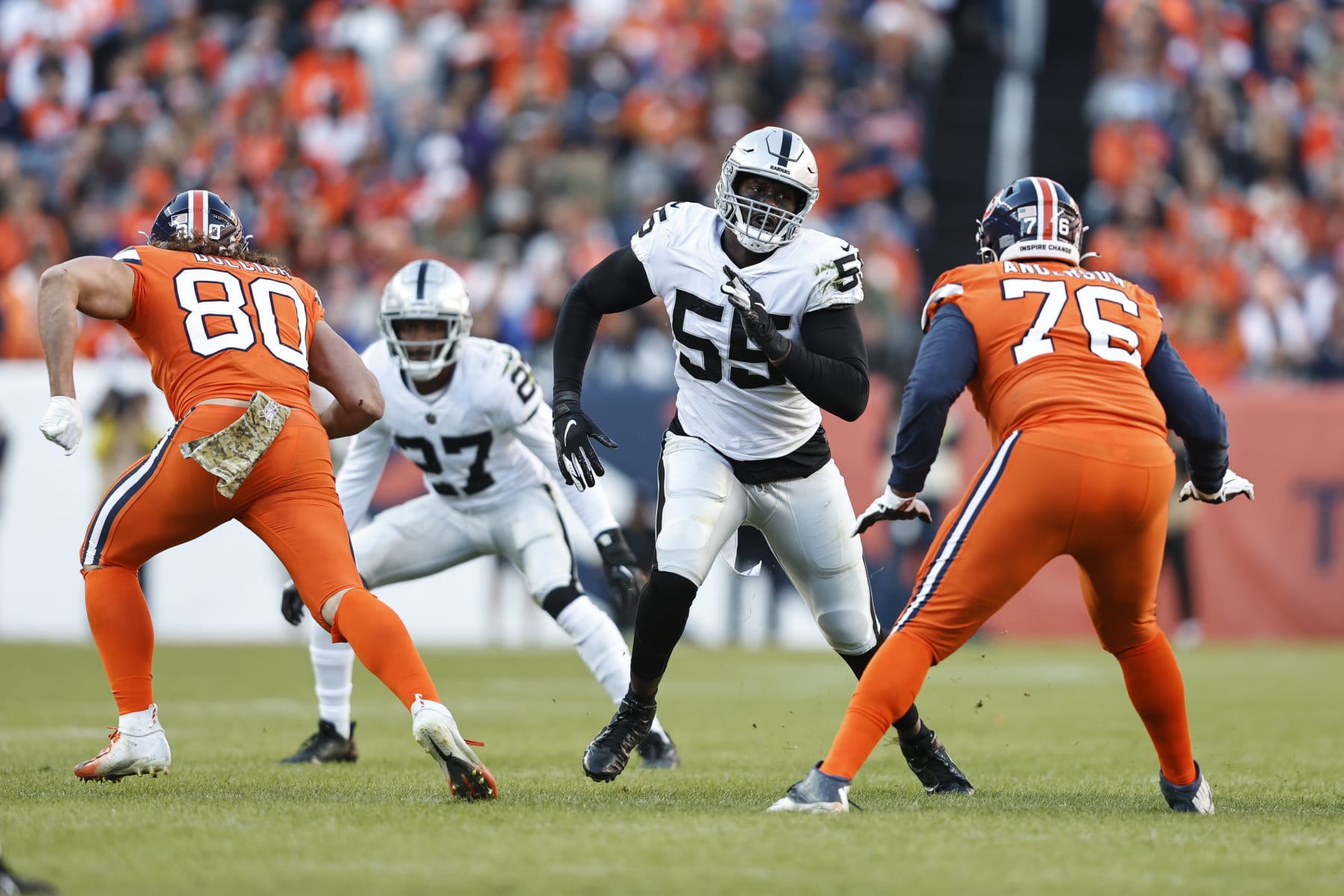 DENVER, COLORADO - NOVEMBER 20: Chandler Jones #55 of the Las Vegas Raiders rushes the quarterback against Calvin Anderson #76 of the Denver Broncos during an NFL game between the Las Vegas Raiders and Denver Broncos at Empower Field At Mile High on November 20, 2022 in Denver, Colorado. The Las Vegas Raiders won in overtime (Photo by Michael Owens/Getty Images)