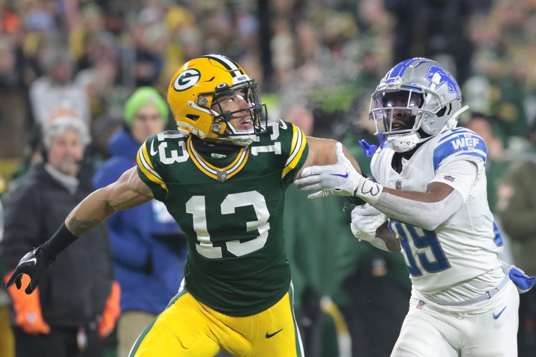 GREEN BAY, WI - JANUARY 08: Green Bay Packers wide receiver Allen Lazard (13) is held during a game between the Green Bay Packers and the Detroit Lions at Lambeau Field on January 8, 2023 in Green Bay, WI. (Photo by Larry Radloff/Icon Sportswire via Getty Images)