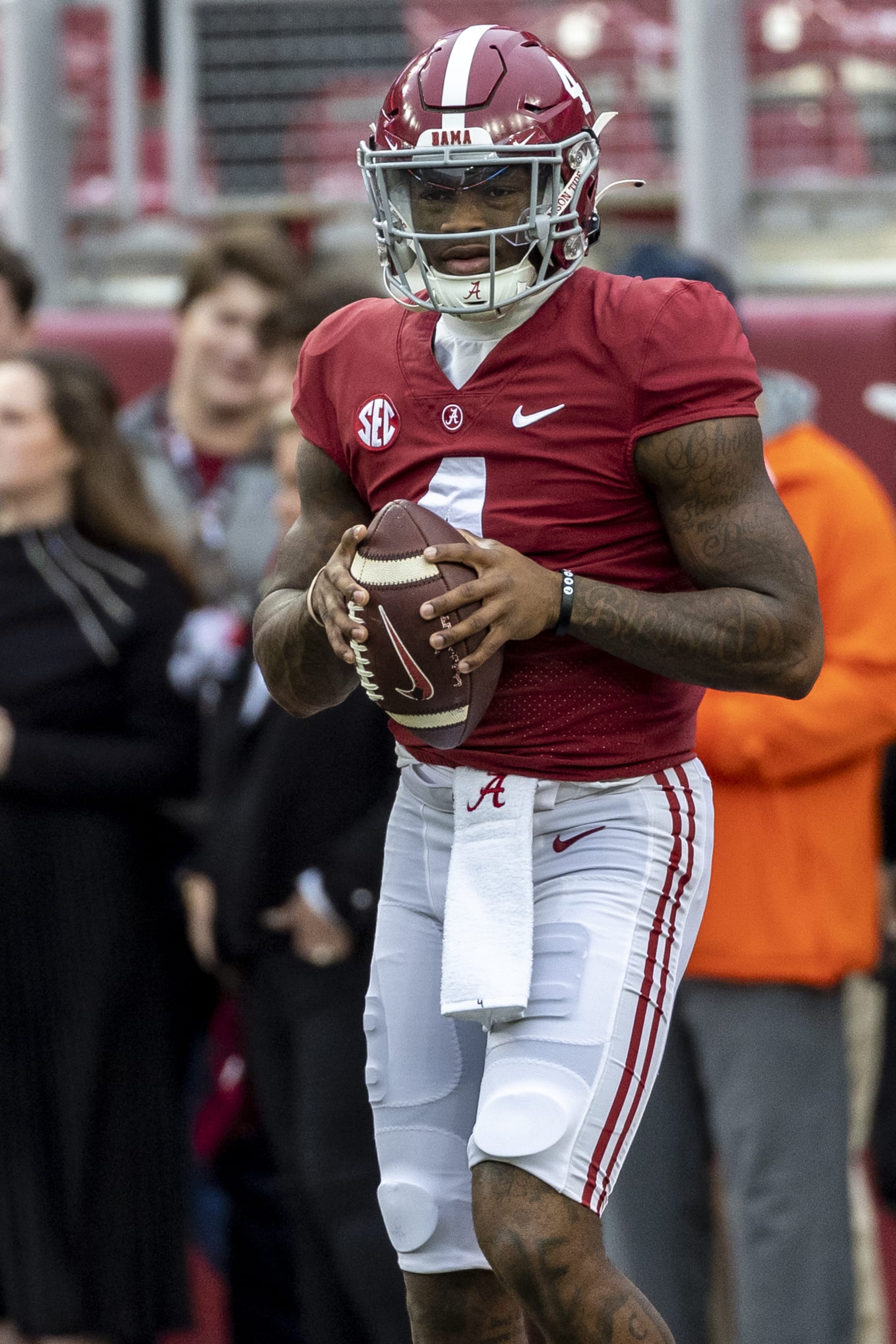 Alabama quarterback Jalen Milroe (4) warms up before an NCAA college football game against Auburn, Saturday, Nov. 26, 2022, in Tuscaloosa, Ala. (AP Photo/Vasha Hunt)
