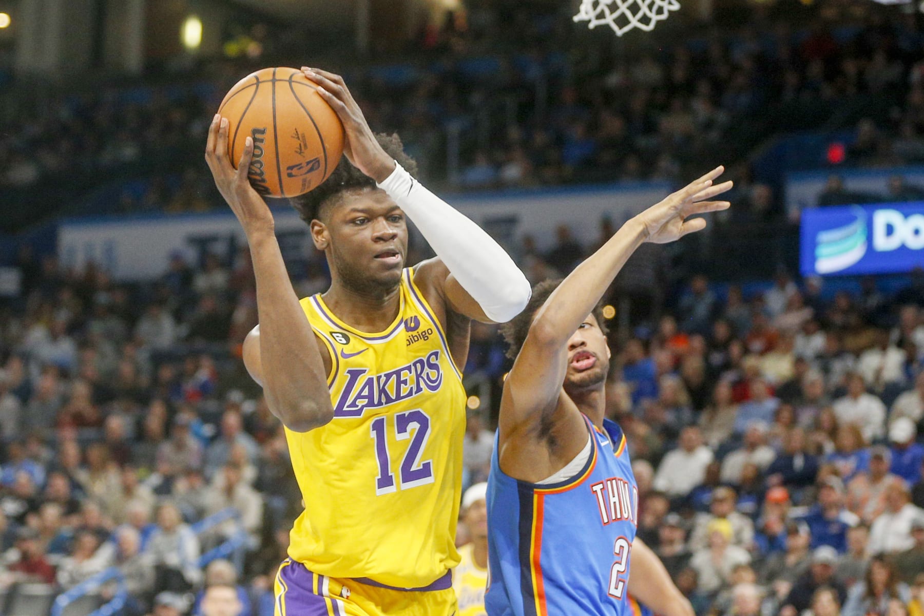 OKLAHOMA CITY, OKLAHOMA - MARCH 01: Mo Bamba #12 of the Los Angeles Lakers grabs a rebound over Aaron Wiggins #21 of the Oklahoma City Thunder during the second quarter at Paycom Center on March 01, 2023 in Oklahoma City, Oklahoma. NOTE TO USER: User expressly acknowledges and agrees that, by downloading and or using this photograph, User is consenting to the terms and conditions of the Getty Images License Agreement.  (Photo by Ian Maule/Getty Images)