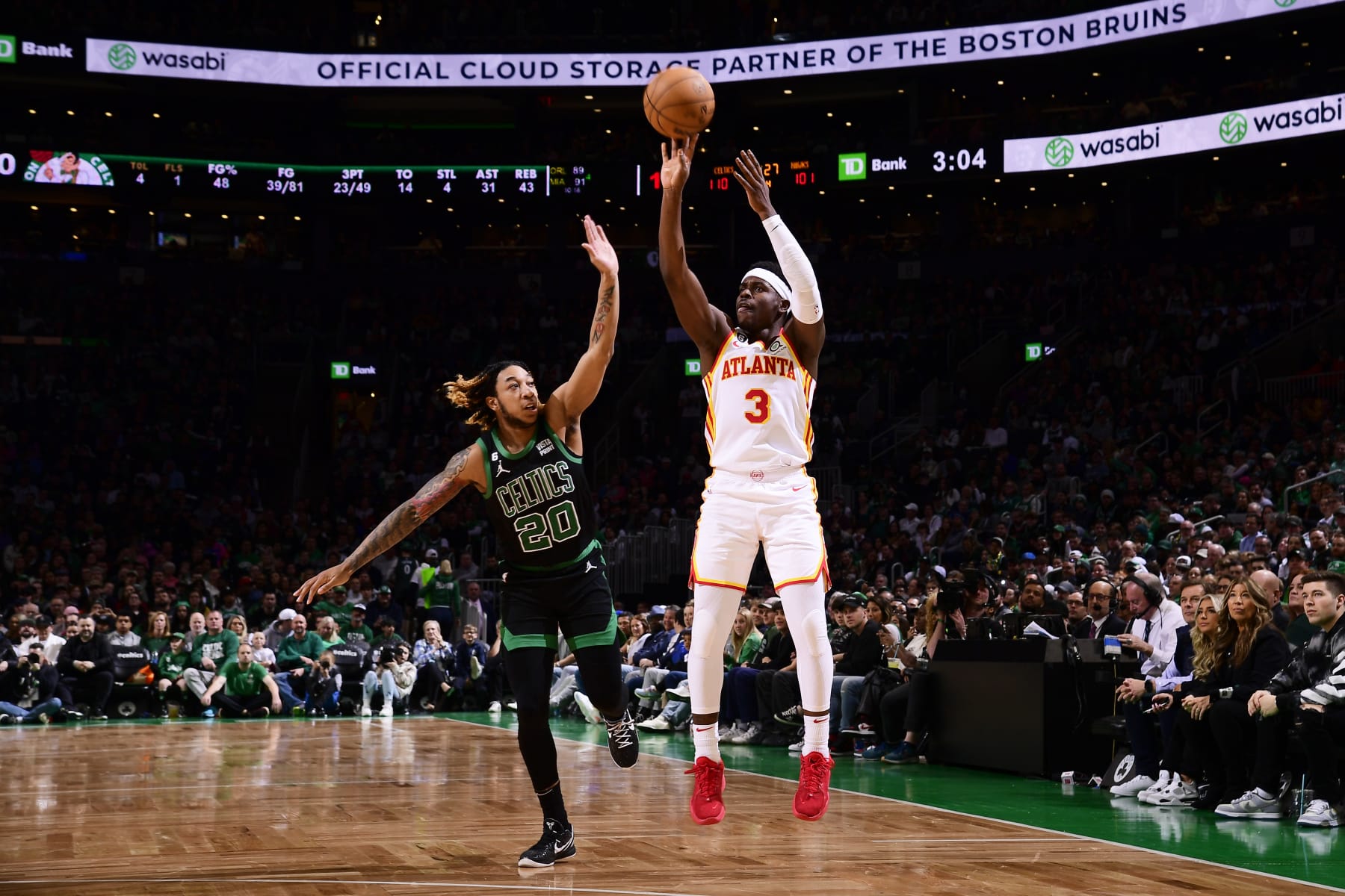 BOSTON, MA - APRIL 9: Aaron Holiday #3 of the Atlanta Hawks shoots a three point basket during the game against the Boston Celtics on April 9, 2023 at the TD Garden in Boston, Massachusetts. NOTE TO USER: User expressly acknowledges and agrees that, by downloading and or using this photograph, User is consenting to the terms and conditions of the Getty Images License Agreement. Mandatory Copyright Notice: Copyright 2023 NBAE  (Photo by Brian Babineau/NBAE via Getty Images)
