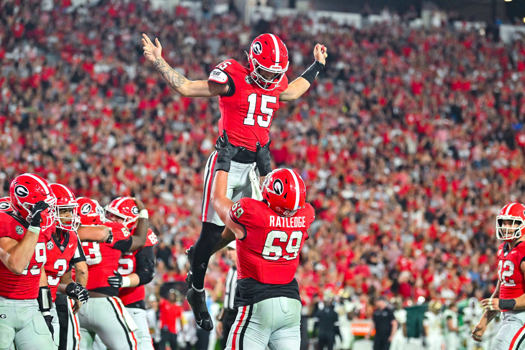 ATLANTA, GA SEPTEMBER 23: Georgia offensive lineman Tate Ratledge (69) lifts quarterback Carson Beck (15) in the air after he scored a touchdown during the college football game between the UAB Blazers and the Georgia Bulldogs on September 23rd, 2023 at Sanford Stadium in Athens, GA. (Photo by Rich von Biberstein/Icon Sportswire via Getty Images) ATLANTA, GA SEPTEMBER 23: Georgia offensive lineman Tate Ratledge (69) lifts quarterback Carson Beck (15) in the air after he scored a touchdown during the college football game between the UAB Blazers and the Georgia Bulldogs on September 23rd, 2023 at Sanford Stadium in Athens, GA. (Photo by Rich von Biberstein/Icon Sportswire via Getty Images)