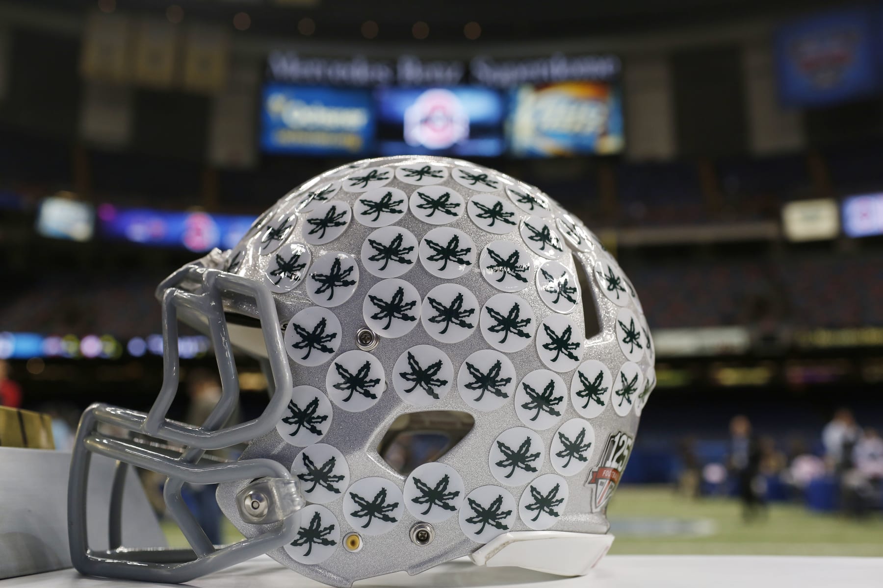 An Ohio State helmet is on display at the Mercedes-Benz Superdome in New Orleans, Tuesday, Dec. 30, 2014. The teams will square off in the Allstate Sugar Bowl NCAA football game, which will be played on New Year's Day. (AP Photo/Brynn Anderson)