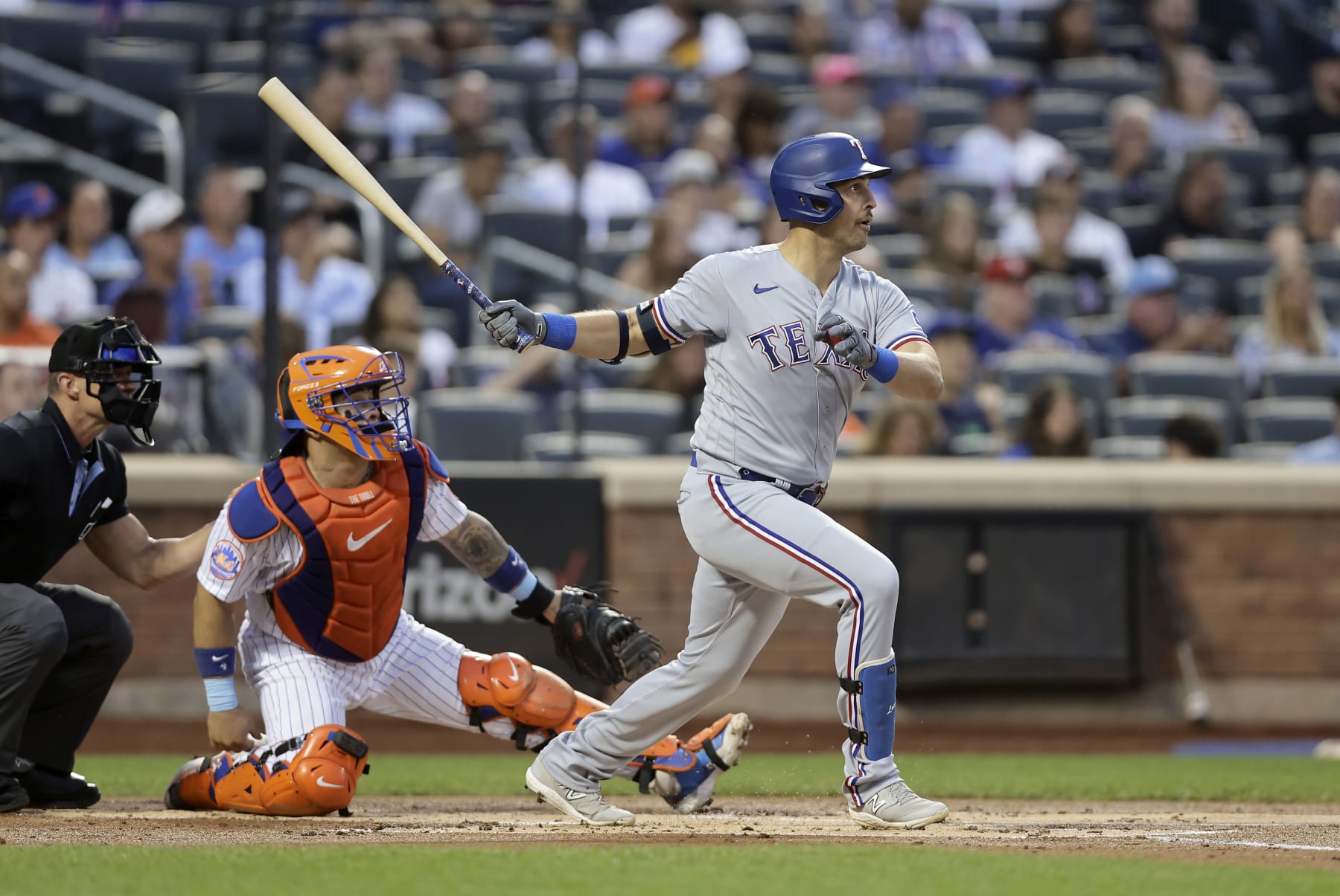 NEW YORK, NEW YORK - AUGUST 29:  Nathaniel Lowe #30 of the Texas Rangers follows through on a first inning double against the New York Mets at Citi Field on August 29, 2023 in New York City. (Photo by Jim McIsaac/Getty Images)