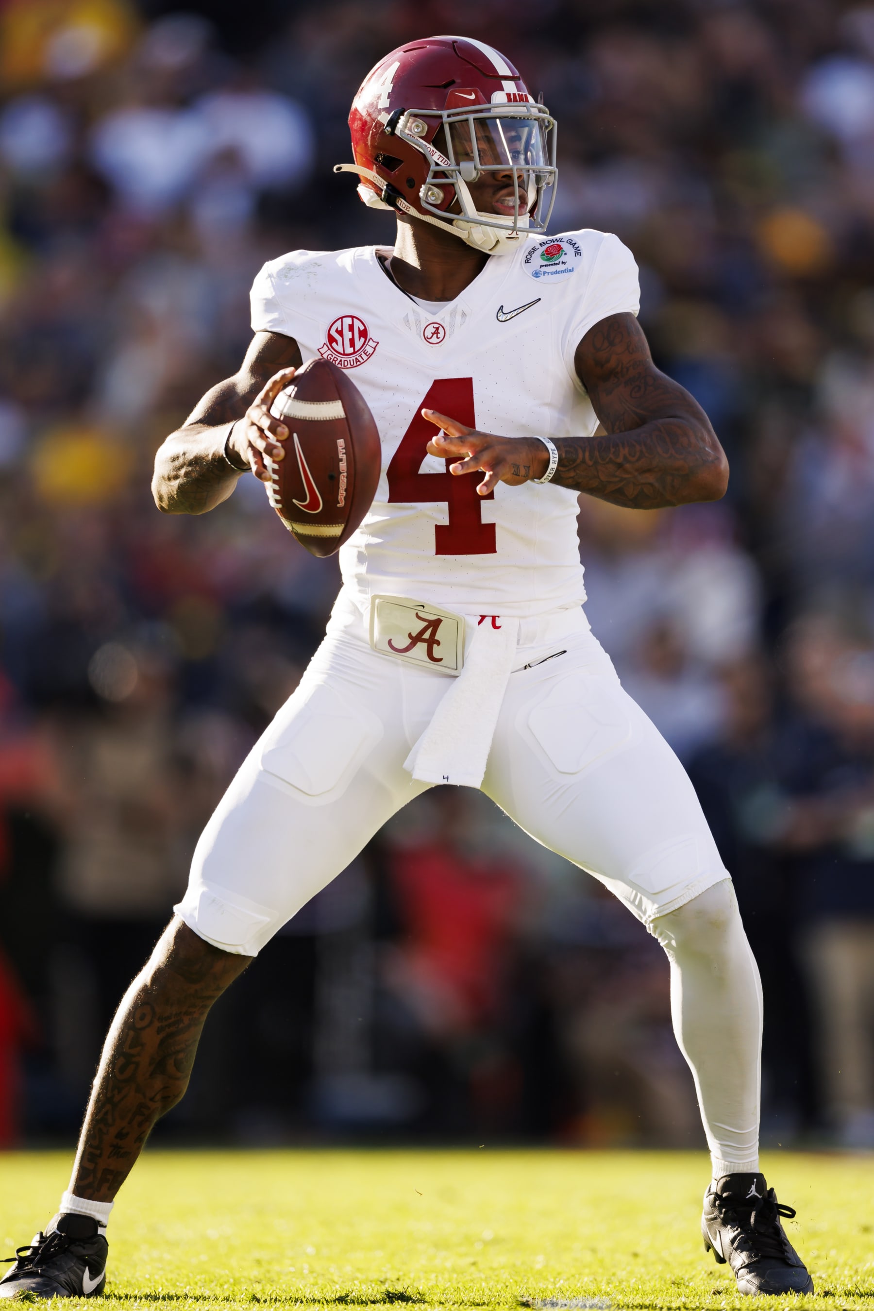 PASADENA, CALIFORNIA - JANUARY 01: Quarterback Jalen Milroe #4 of the Alabama Crimson Tide drops back and looks to throw a pass during the CFP Semifinal Rose Bowl Game against the Michigan Wolverines at Rose Bowl Stadium on January 1, 2024 in Pasadena, California. (Photo by Ryan Kang/Getty Images)