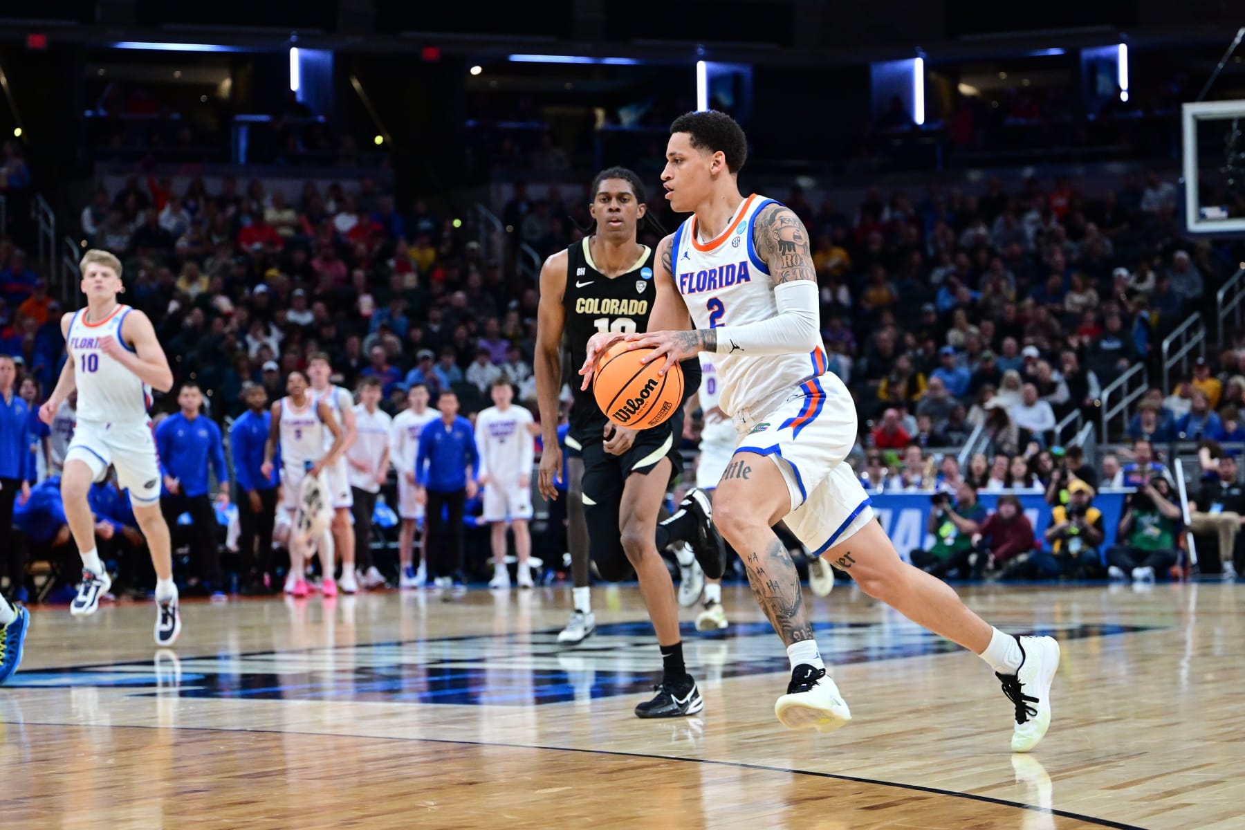 INDIANAPOLIS, INDIANA - MARCH 22: Riley Kugel #2 of the Florida Gators dribbles the ball to the basket against the Colorado Buffaloes during the first round of the 2024 NCAA Men's Basketball Tournament held at Gainbridge Fieldhouse on March 22, 2024 in Indianapolis, Indiana. (Photo by Ben Solomon/NCAA Photos via Getty Images)