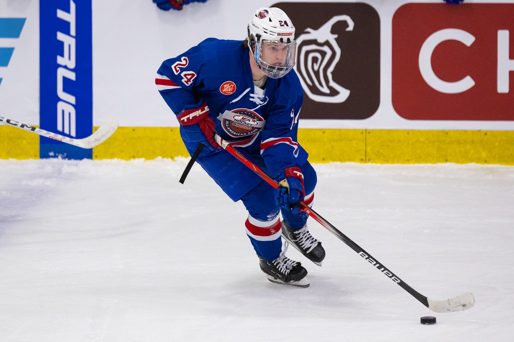 PLYMOUTH, MI - JANUARY 15: Cole Eiserman #24 of Team Blue skates with the puck during Chipotle All-American Game between Team Blue and Team White at USA Hockey Arena on January 15, 2024 in Plymouth, Michigan. (Photo by Michael Miller/ISI Photos/Getty Images)