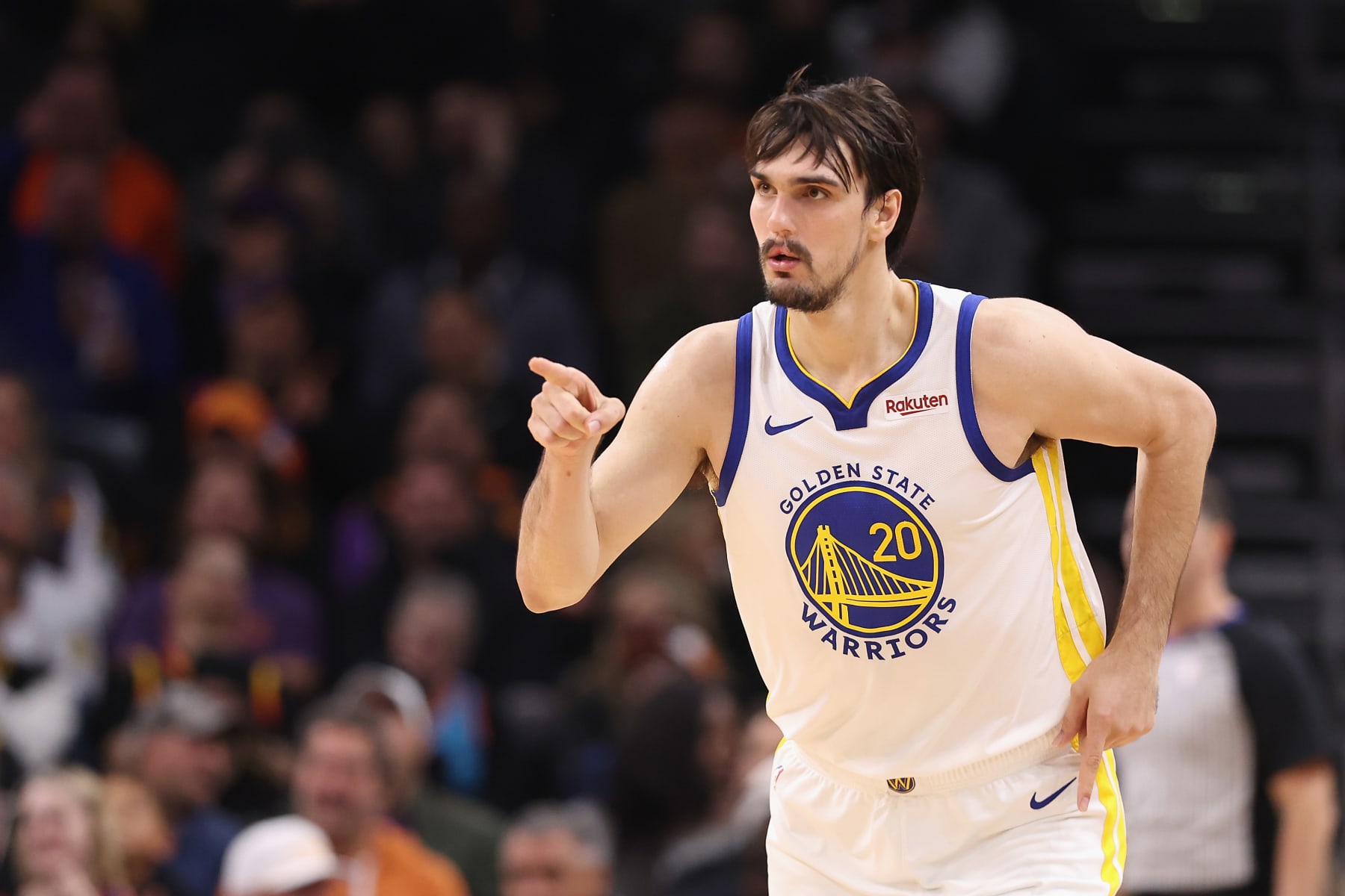 PHOENIX, ARIZONA - DECEMBER 12: Dario Saric #20 of the Golden State Warriors reacts to a three-point shot against the Phoenix Suns during the first half of the NBA game at Footprint Center on December 12, 2023 in Phoenix, Arizona. NOTE TO USER: User expressly acknowledges and agrees that, by downloading and or using this photograph, User is consenting to the terms and conditions of the Getty Images License Agreement.  (Photo by Christian Petersen/Getty Images)