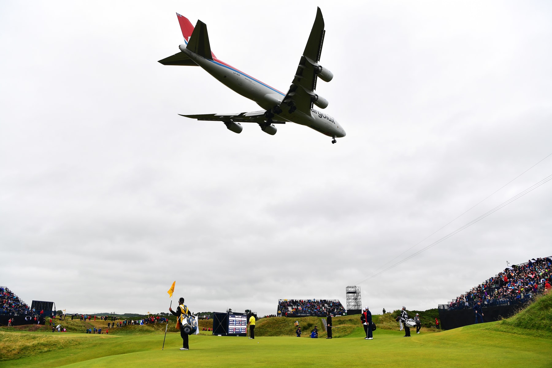 TROON, SCOTLAND - JULY 15: A plane flies over the 8th green during the second round on day two of the 145th Open Championship at Royal Troon on July 15, 2016 in Troon, Scotland. (Photo by Stuart Franklin/Getty Images) TROON, SCOTLAND - JULY 15: A plane flies over the 8th green during the second round on day two of the 145th Open Championship at Royal Troon on July 15, 2016 in Troon, Scotland. (Photo by Stuart Franklin/Getty Images)