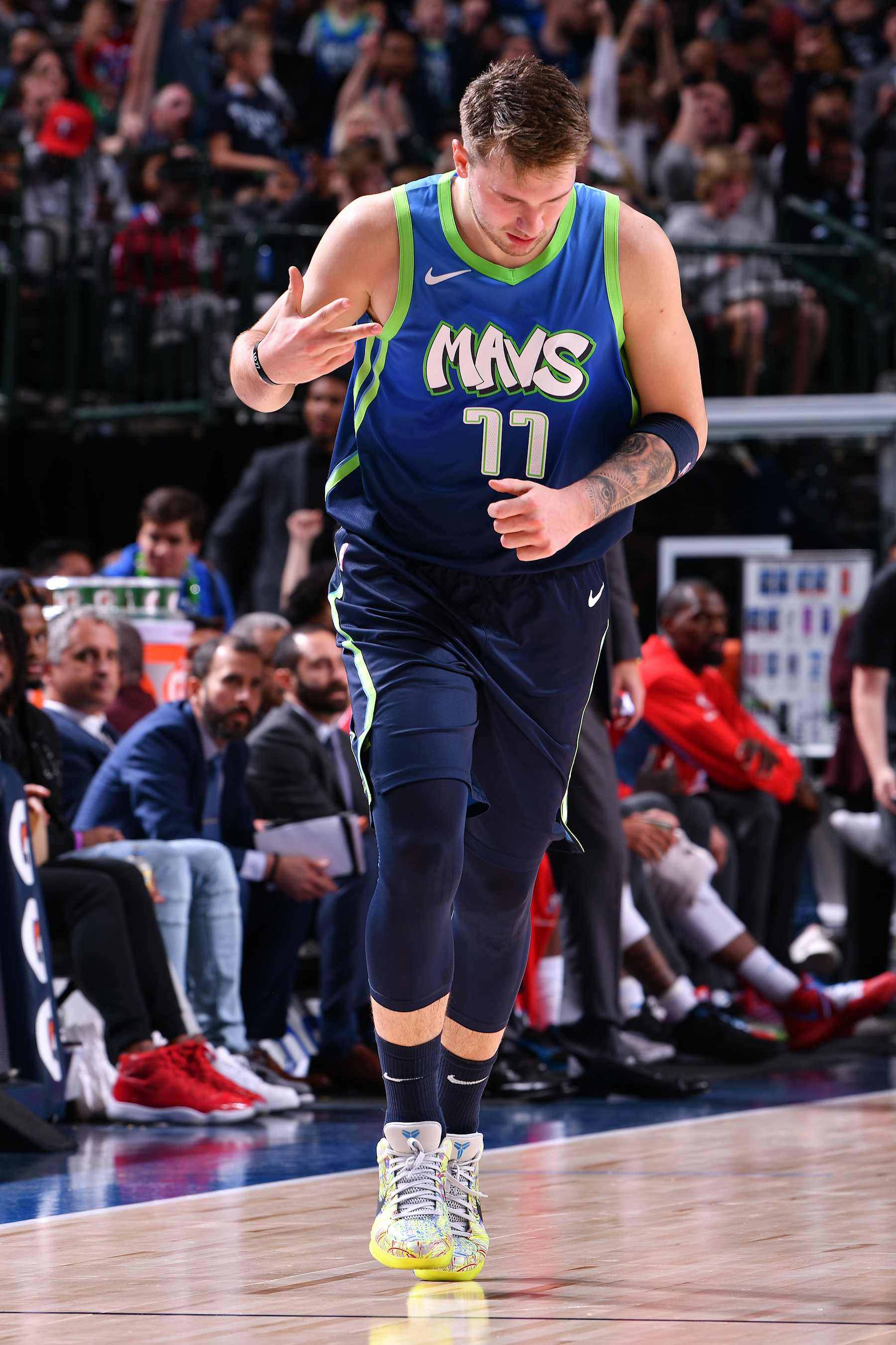 DALLAS, TX - DECEMBER 8: Luka Doncic #77 of the Dallas Mavericks reacts to a play against the Sacramento Kings on December 8, 2019 at the American Airlines Center in Dallas, Texas. NOTE TO USER: User expressly acknowledges and agrees that, by downloading and or using this photograph, User is consenting to the terms and conditions of the Getty Images License Agreement. Mandatory Copyright Notice: Copyright 2019 NBAE (Photo by Glenn James/NBAE via Getty Images)