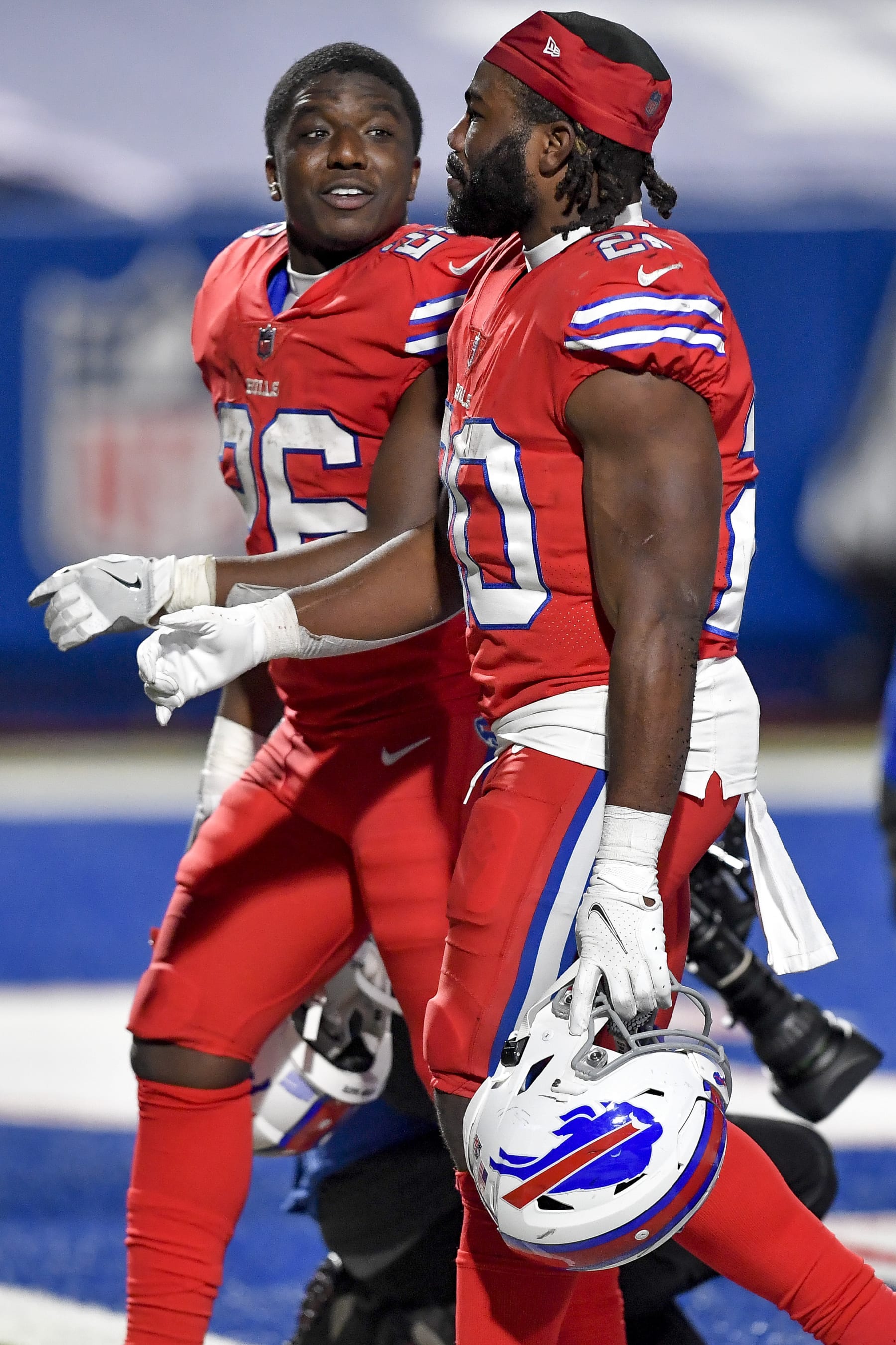 Buffalo Bills running backs Devin Singletary (26) and Zack Moss (20) walk off the field after an NFL football game against the Pittsburgh Steelers in Orchard Park, N.Y., Sunday, Dec. 13, 2020. (AP Photo/Adrian Kraus)