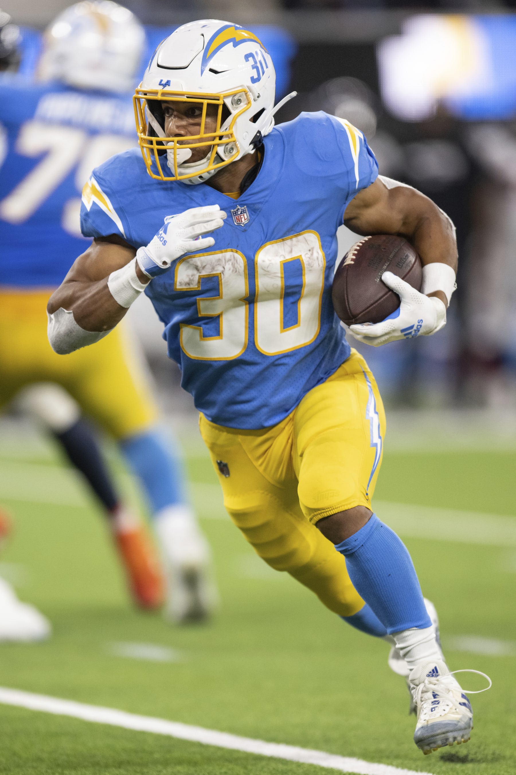 Los Angeles Chargers running back Austin Ekeler (30) runs with the ball during an NFL football game against the Denver Broncos, Monday, Oct. 17, 2022, in Inglewood, Calif. (AP Photo/Kyusung Gong)