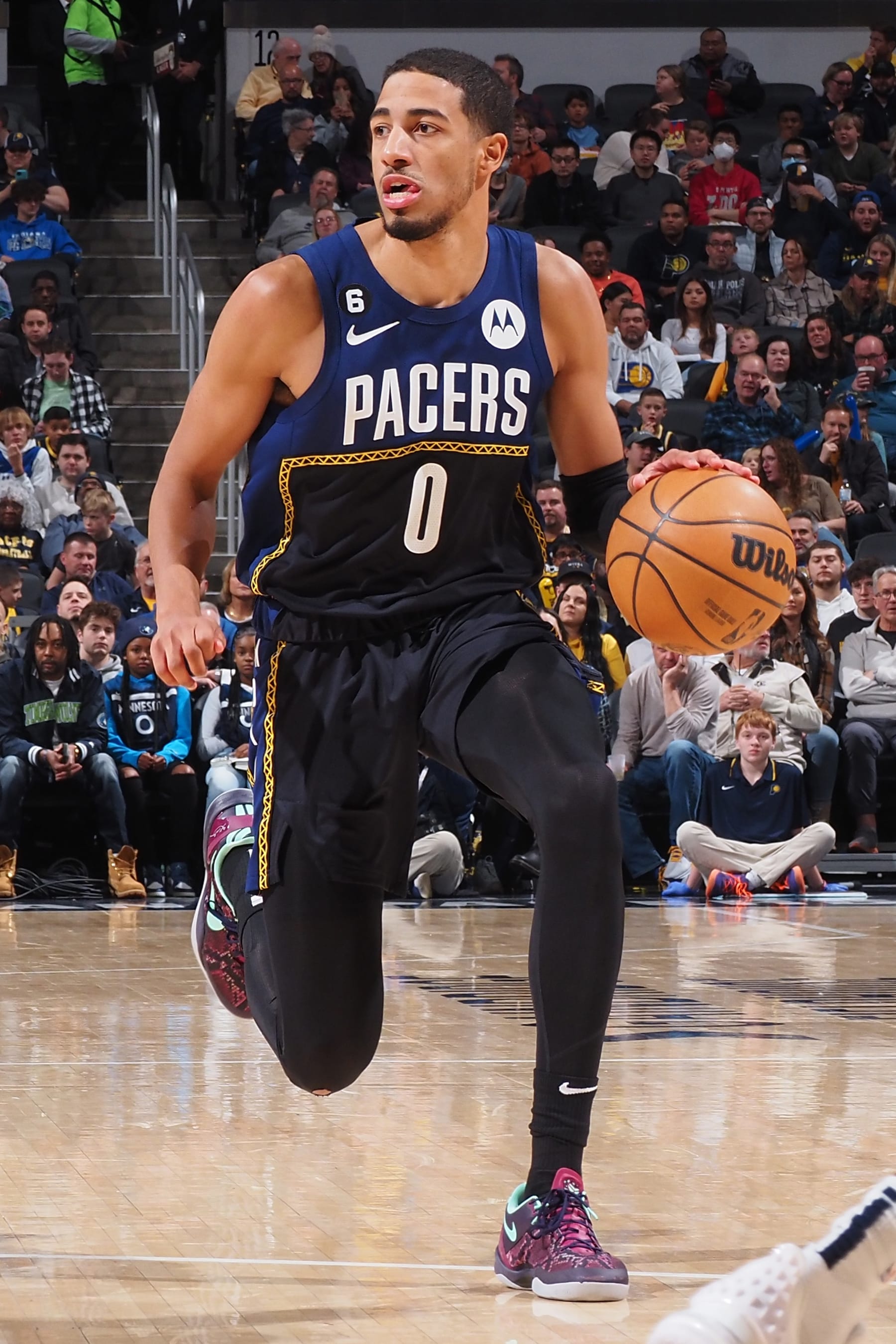 INDIANAPOLIS, IN - NOVEMBER 23:  Tyrese Haliburton #0 of the Indiana Pacers handles the ball during the game against the Minnesota Timberwolves on November 23, 2022 at Gainbridge Fieldhouse in Indianapolis, Indiana. NOTE TO USER: User expressly acknowledges and agrees that, by downloading and or using this Photograph, user is consenting to the terms and conditions of the Getty Images License Agreement. Mandatory Copyright Notice: Copyright 2022 NBAE (Photo by Ron Hoskins/NBAE via Getty Images)
