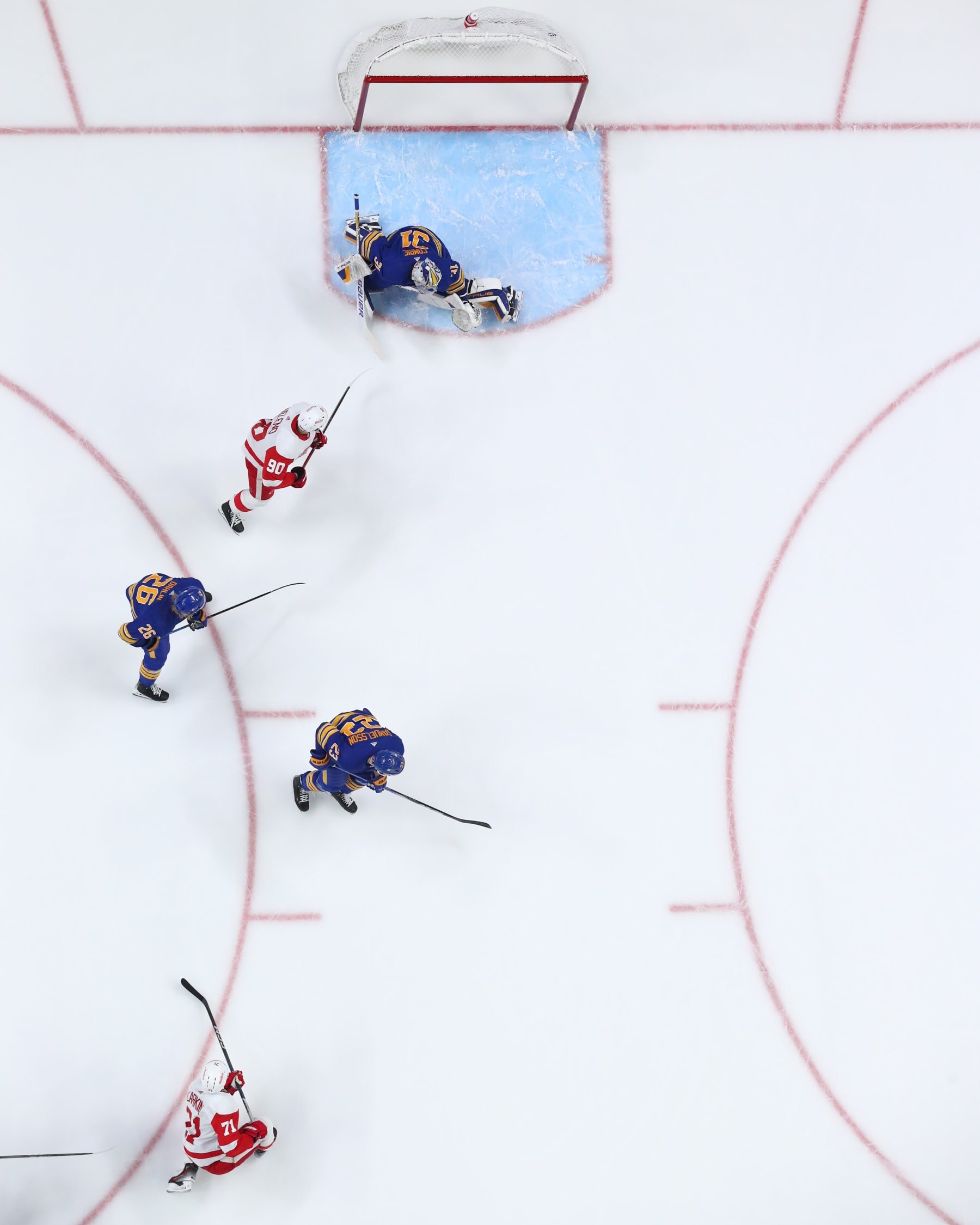 BUFFALO, NEW YORK - DECEMBER 5: Dylan Larkin #71 of the Detroit Red Wings scores a first period goal against Eric Comrie #31 of the Buffalo Sabres during an NHL game on December 5, 2023 at KeyBank Center in Buffalo, New York. (Photo by Bill Wippert/NHLI via Getty Images)