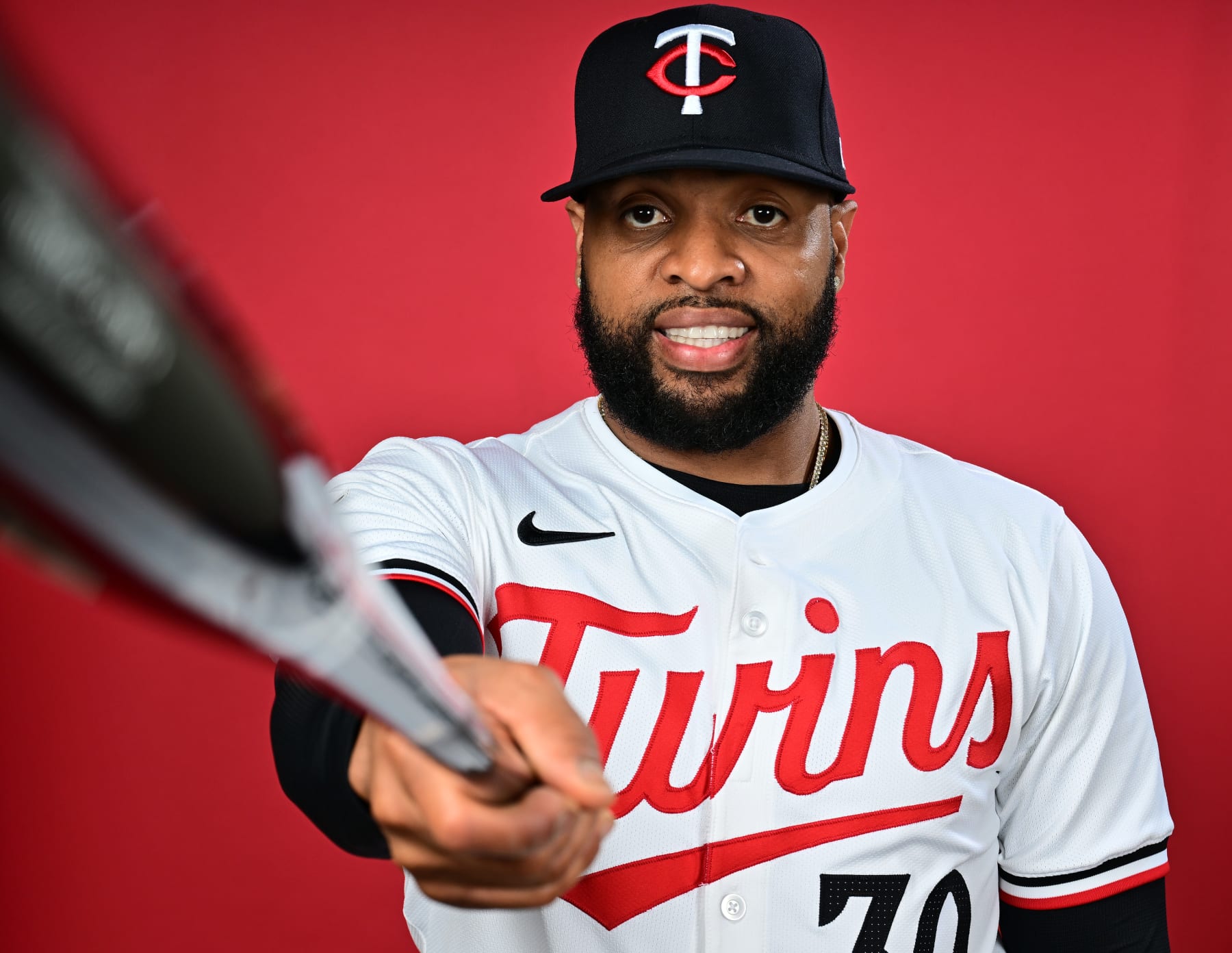 FORT MYERS, FLORIDA - FEBRUARY 22: Carlos Santana #30 of the Minnesota Twins poses during the 2024 Minnesota Twins Photo Day on February 22, 2024 at the Lee County Sports Complex in Fort Myers, Florida. (Photo by Julio Aguilar/Getty Images)