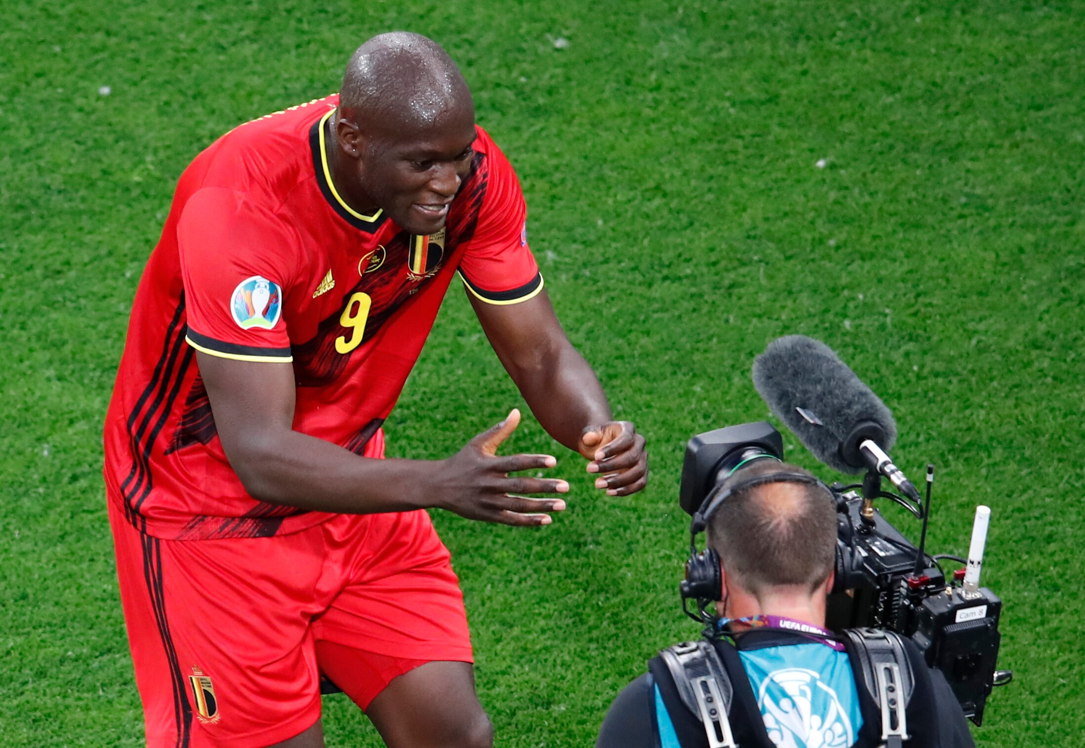 Belgium's Romelu Lukaku celebrates after scoring his sides first goal during the Euro 2020 soccer championship group B match between Russia and Belgium at the Saint Petersburg stadium in St. Petersburg, Russia, Saturday, June 12, 2021. (Anton Vaganov/Pool via AP)