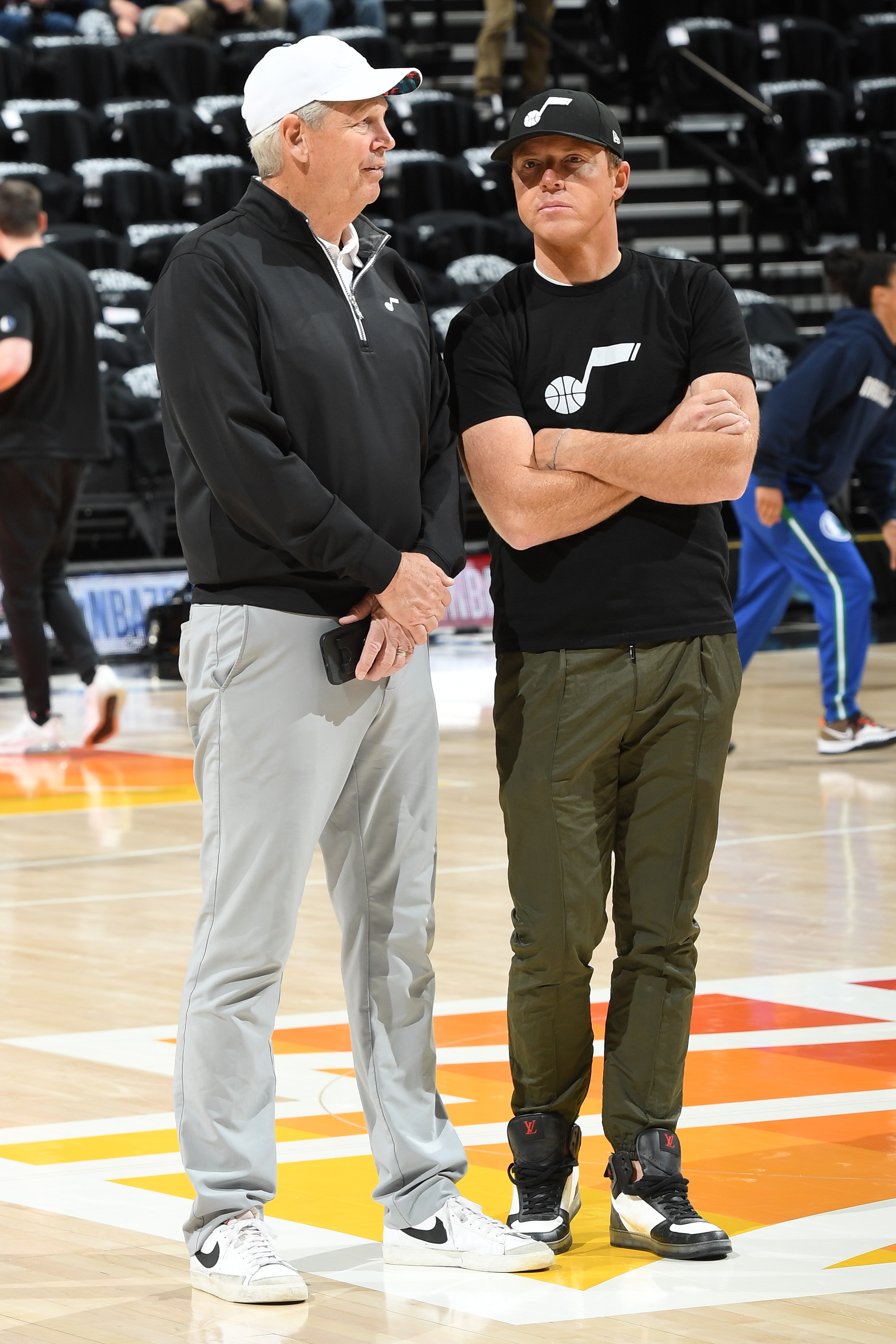 SALT LAKE CITY, UT - APRIL 28: Former NBA player Danny Ainge talks to Utah Jazz owner Ryan Smith before the game between the Dallas Mavericks and Utah Jazz during Round 1 Game 6 of the 2022 NBA Playoffs on April 28, 2022 at vivint.SmartHome Arena in Salt Lake City, Utah. NOTE TO USER: User expressly acknowledges and agrees that, by downloading and or using this Photograph, User is consenting to the terms and conditions of the Getty Images License Agreement. Mandatory Copyright Notice: Copyright 2022 NBAE (Photo by Andrew D. Bernstein/NBAE via Getty Images)