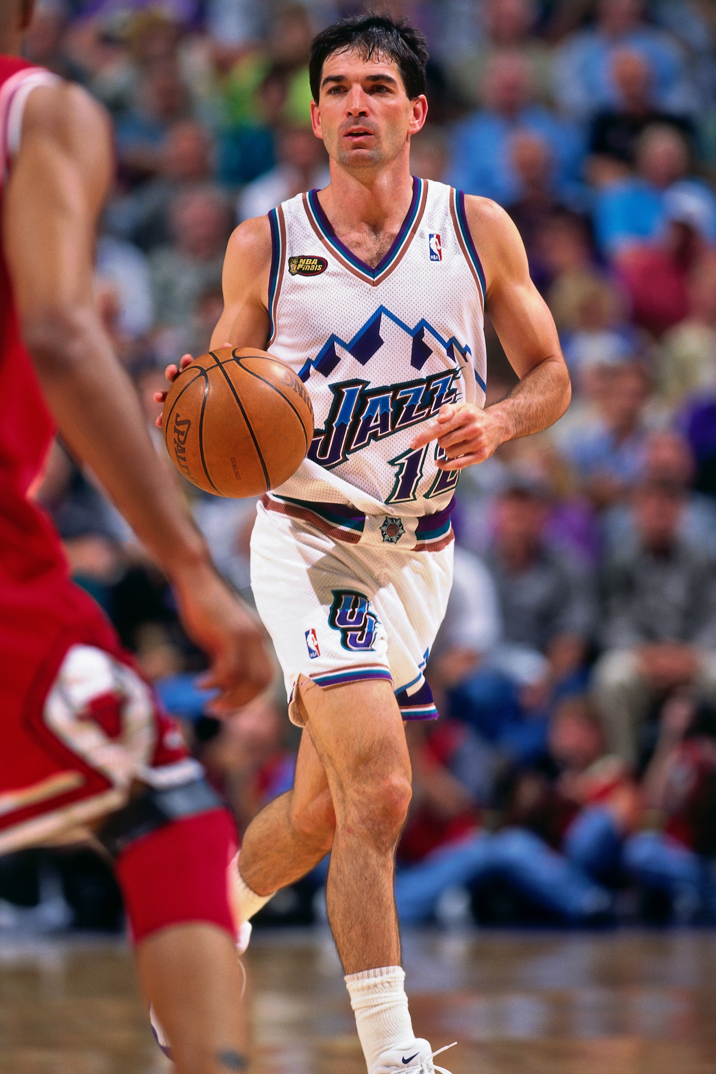SALT LAKE CITY, UT - JUNE 14: John Stockton #12 of the Utah Jazz handles the ball against the Chicago Bulls during Game Six of the 1998 NBA Finals on June 14, 1998 at the Delta Center in Salt Lake City, Utah. NOTE TO USER: User expressly acknowledges and agrees that, by downloading and/or using this photograph, user is consenting to the terms and conditions of the Getty Images License Agreement. Mandatory Copyright Notice: Copyright 1998 NBAE (Photo by Andy Hayt/NBAE via Getty Images)