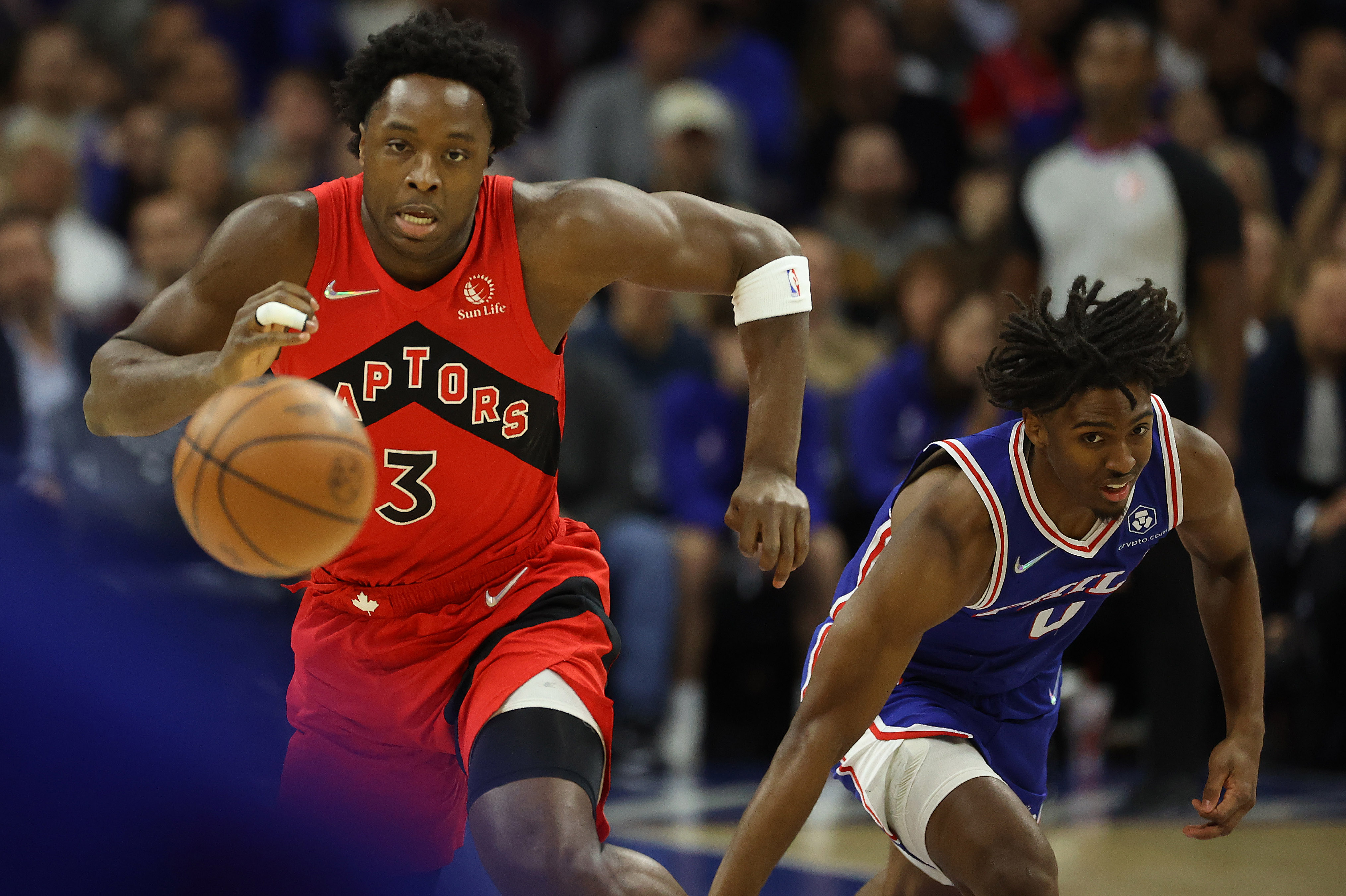 PHILADELPHIA , PA- APRIL 25  - Toronto Raptors forward OG Anunoby (3) chases a loose ball with Philadelphia 76ers guard Tyrese Maxey (0) as the Toronto Raptors play the Philadelphia 76ers in Game 5  at Wells Fargo Center in Philadelphia . April 25, 2022.        (Steve Russell/Toronto Star via Getty Images)