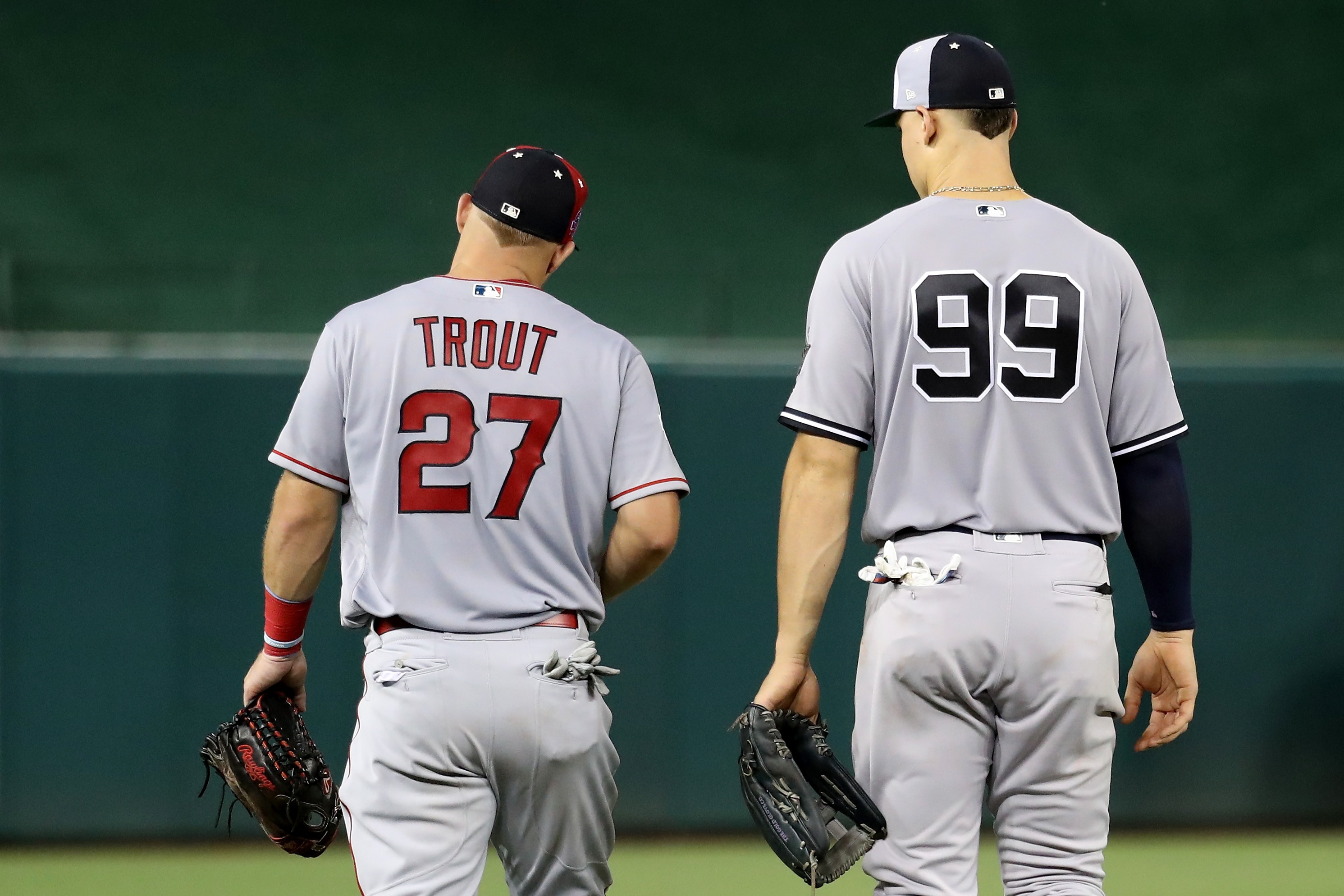 WASHINGTON, DC - JULY 17:  Mike Trout #27 of the Los Angeles Angels of Anaheim and the American League and Aaron Judge #99 of the New York Yankees and the American League take the field in the sixth inning against the National League during the 89th MLB All-Star Game, presented by Mastercard at Nationals Park on July 17, 2018 in Washington, DC.  (Photo by Rob Carr/Getty Images)