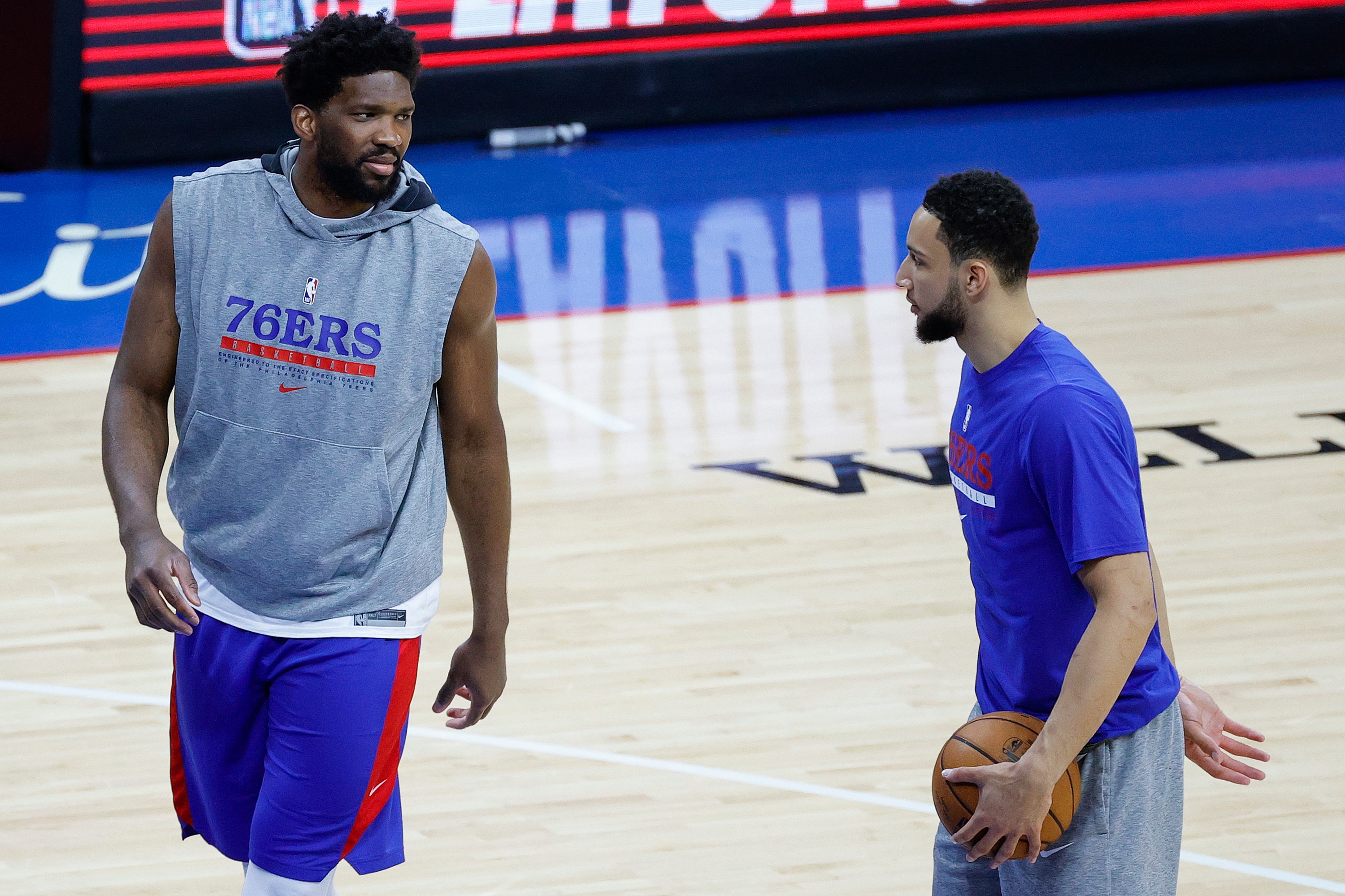 PHILADELPHIA, PENNSYLVANIA - JUNE 02: Joel Embiid #21 and Ben Simmons #25 of the Philadelphia 76ers warm up before playing against the Washington Wizards during Game Five of the Eastern Conference first round series at Wells Fargo Center on June 2, 2021 in Philadelphia, Pennsylvania. NOTE TO USER: User expressly acknowledges and agrees that, by downloading and or using this photograph, User is consenting to the terms and conditions of the Getty Images License Agreement. (Photo by Tim Nwachukwu/Getty Images)