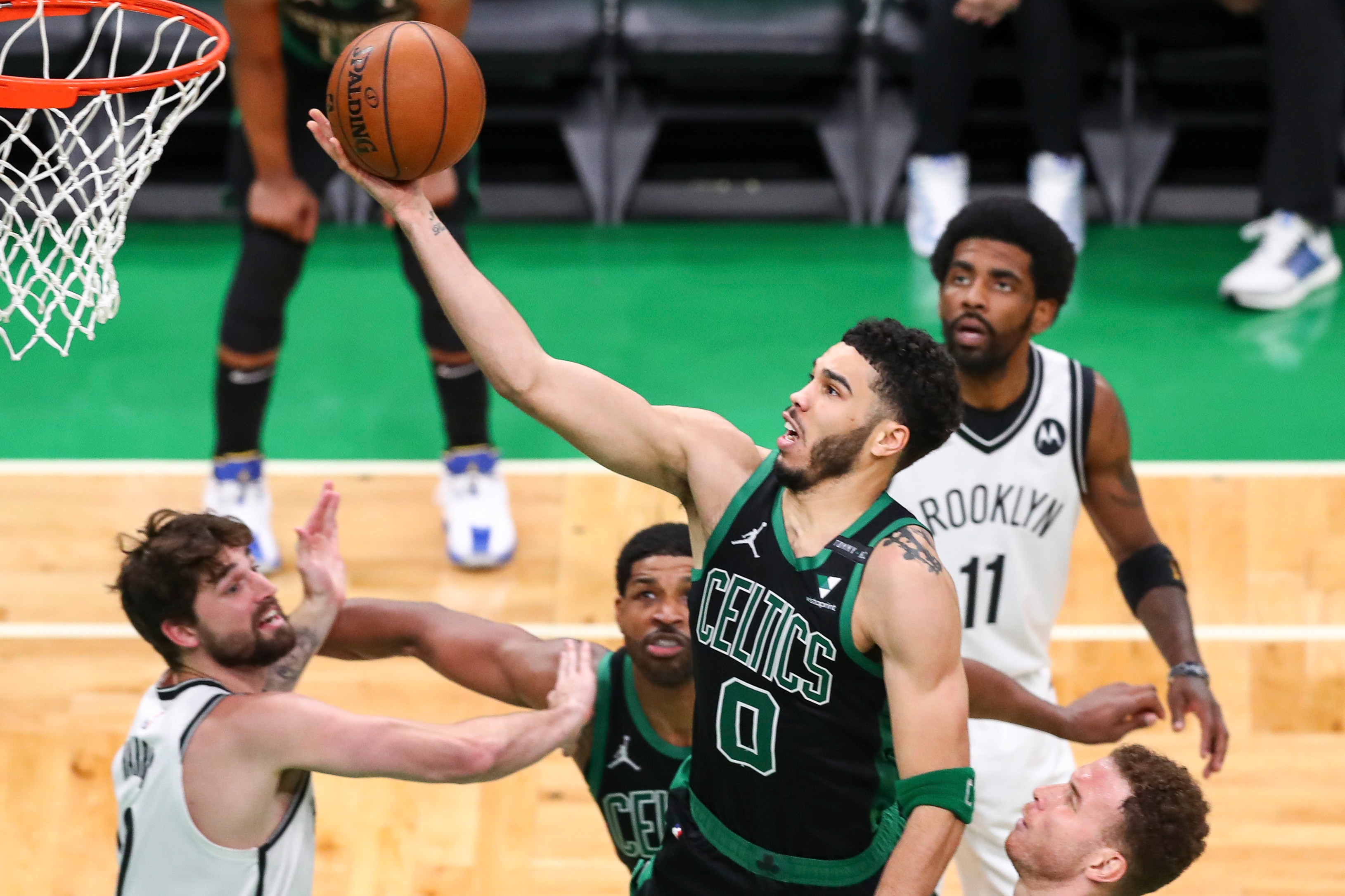 BOSTON, MA - MAY 28:  Jayson Tatum #0 of the Boston Celtics drives to the basket past Blake Griffin #2 of the Brooklyn Nets during Game Three of the Eastern Conference first round series at TD Garden on May 28, 2021 in Boston, Massachusetts. NOTE TO USER: User expressly acknowledges and agrees that, by downloading and or using this photograph, User is consenting to the terms and conditions of the Getty Images License Agreement. (Photo by Adam Glanzman/Getty Images)