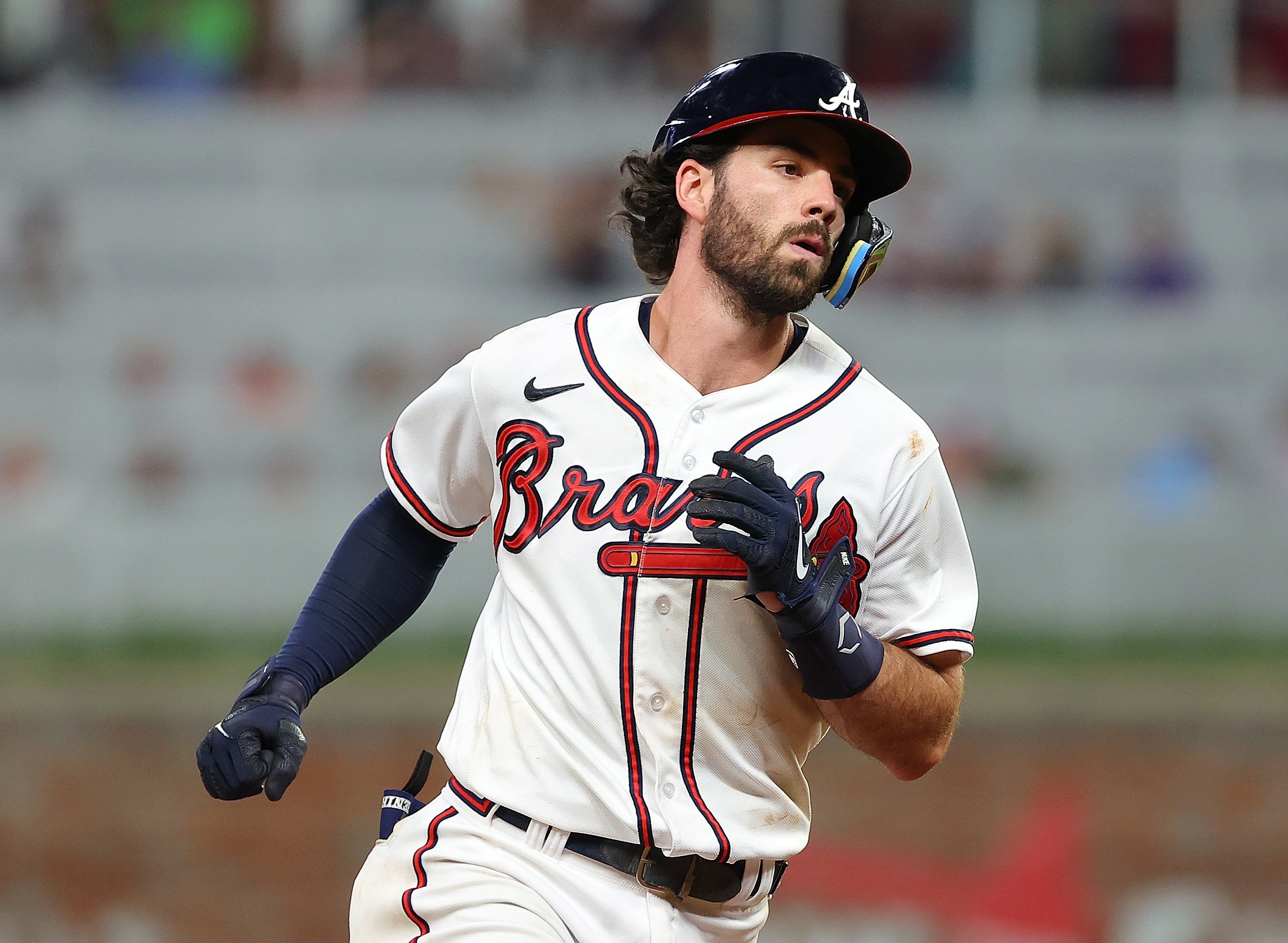 ATLANTA, GEORGIA - JUNE 22:  Dansby Swanson #7 of the Atlanta Braves rounds third base after hitting a solo homer in the ninth inning against the San Francisco Giants at Truist Park on June 22, 2022 in Atlanta, Georgia. (Photo by Kevin C. Cox/Getty Images)