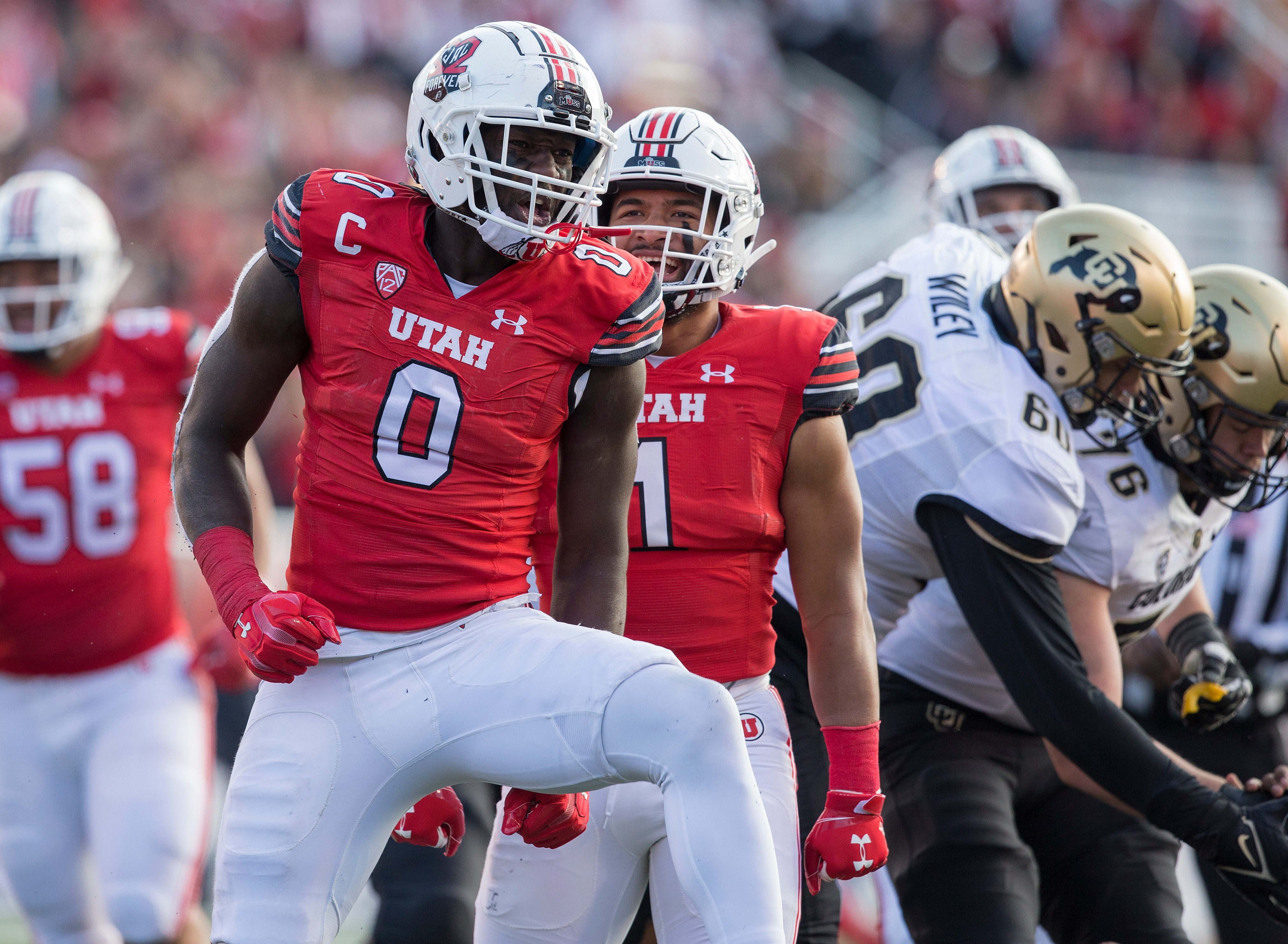 SALT LAKE CITY, UT -  NOVEMBER 26: Devin Lloyd #0 of the Utah Utes celebrates sacking Brendon Lewis #12 of the Colorado Buffaloes during their game November 26, 2021 at Rice-Eccles Stadium in Salt Lake City , Utah. (Photo by Chris Gardner/Getty Images)