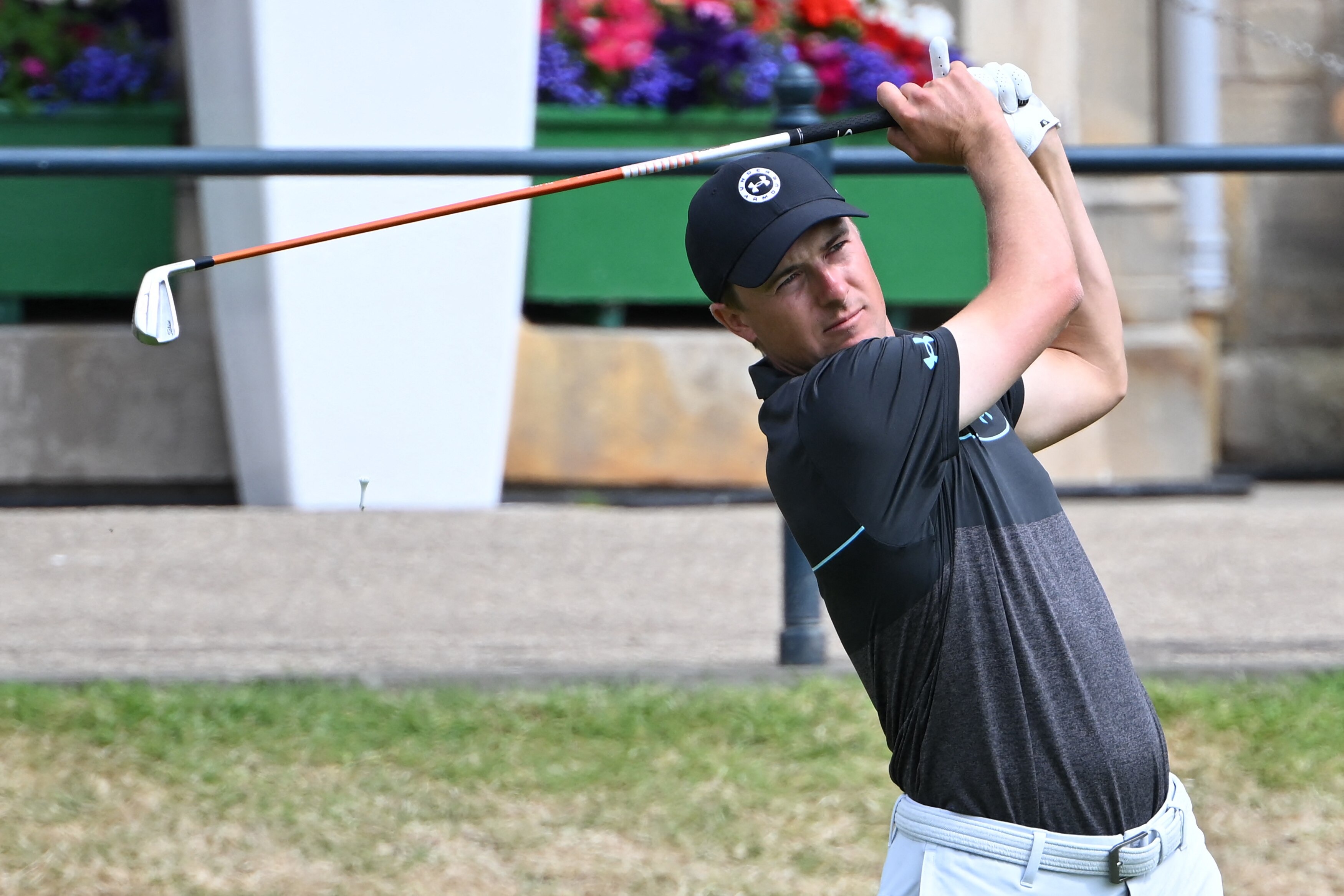 US golfer Jordan Spieth watches his shot from the 1st tee during The R&A Celebration of Champions, part of the build-up towards The 150th British Open Golf Championship on The Old Course at St Andrews in Scotland, on July 11, 2022. - The Open's Champion Golfers, women's Major Champions, male and female amateur Champions, and golfers with disability Champions compete in a four-hole challenge over the 1st, 2nd, 17th, and 18th holes of the Old Course.  - RESTRICTED TO EDITORIAL USE (Photo by Paul ELLIS / AFP) / RESTRICTED TO EDITORIAL USE (Photo by PAUL ELLIS/AFP via Getty Images)