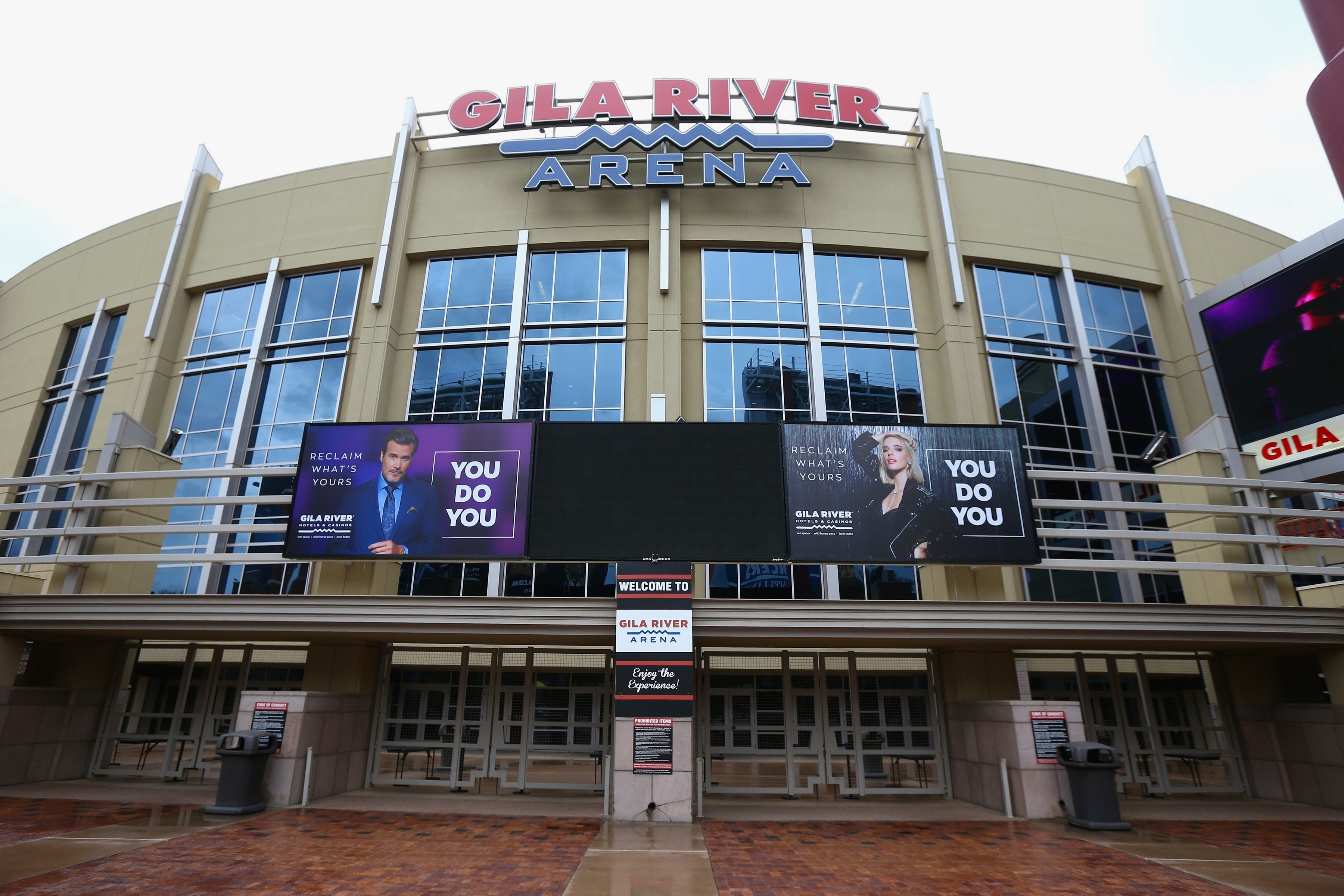 The Gila River Arena, home of the Arizona Coyotes hockey team, is closed as the Coyotes' scheduled game with the Vancouver Canucks was canceled Thursday, March 12, 2020, in Glendale, Ariz. The NHL is suspending its season amid the coronavirus outbreak, the league announced Thursday. (AP Photo/Ross D. Franklin)