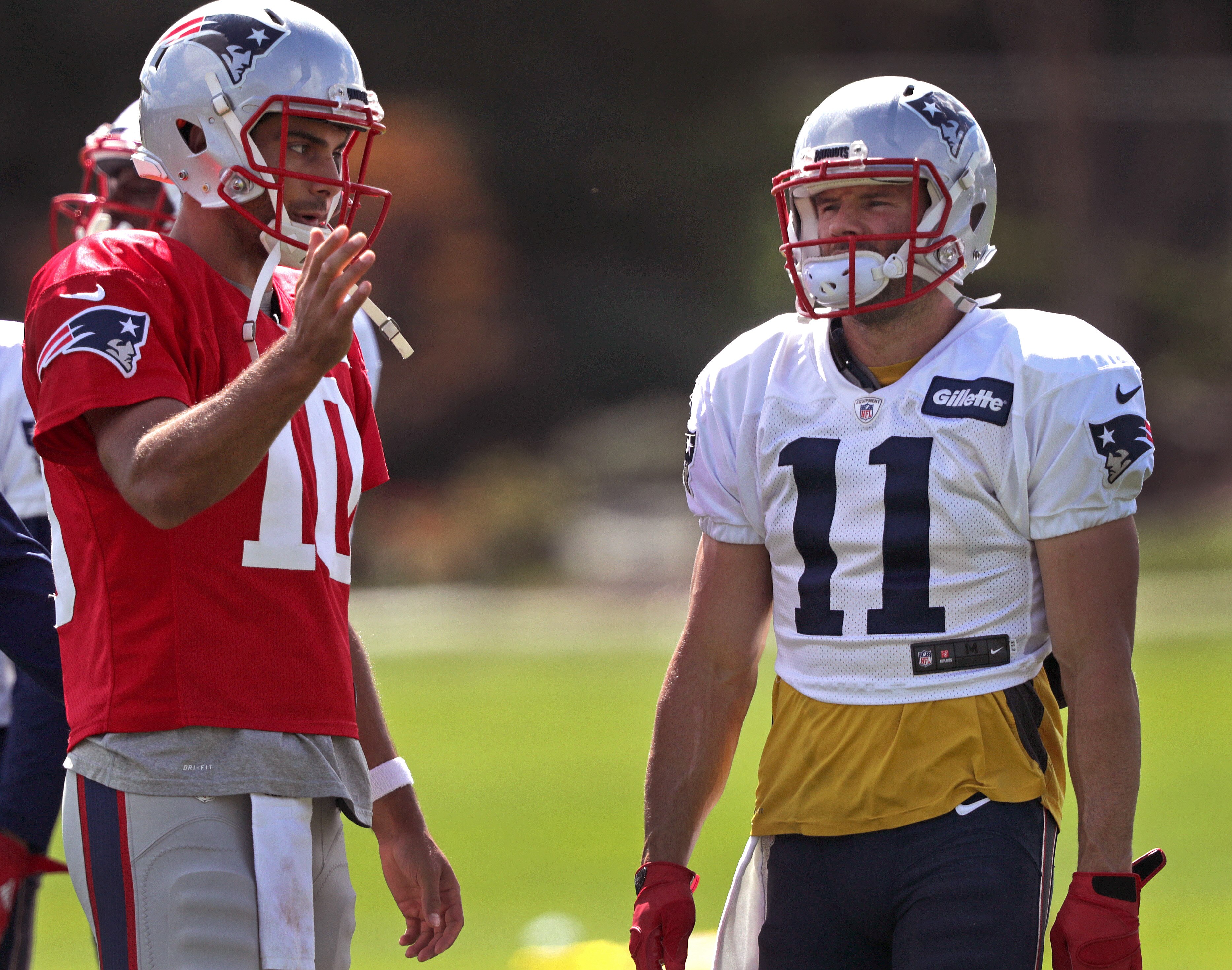 FOXBOROUGH, MA - SEPTEMBER 15: New England Patriots quarterback Jimmy Garoppolo (10) talks to New England Patriots wide receiver Julian Edelman (11) during practice at Gillette Stadium in Foxborough, Mass., on Sept. 15, 2016. (Photo by Barry Chin/The Boston Globe via Getty Images)