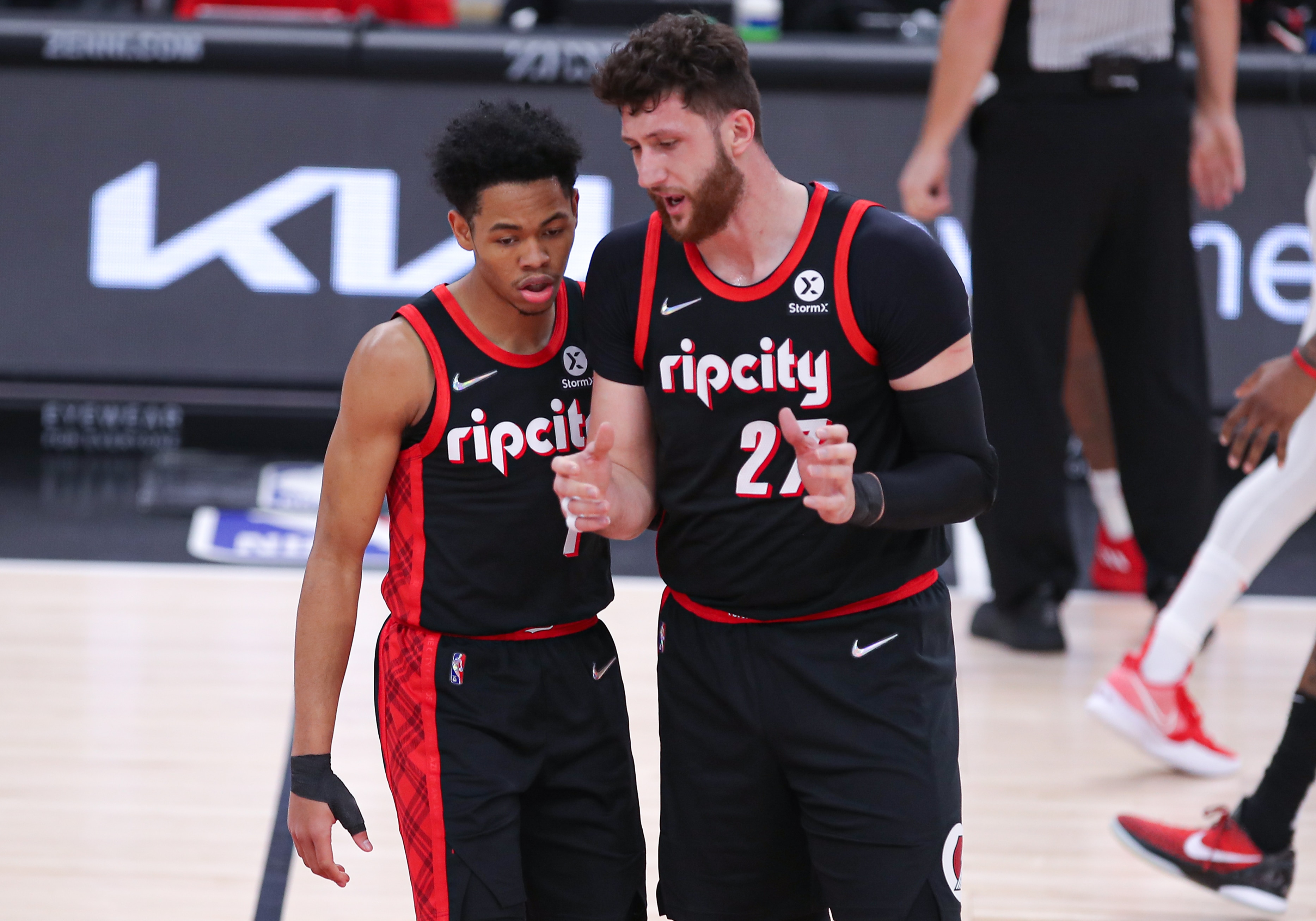 CHICAGO, IL - JANUARY 30: Portland Trail Blazers center Jusuf Nurkic (27) talks with Portland Trail Blazers guard Anfernee Simons (1) during a timeout during a NBA game between the Portland  Trail Blazers and the Chicago Bulls on January 30, 2022 at the United Center in Chicago, IL. (Photo by Melissa Tamez/Icon Sportswire via Getty Images)
