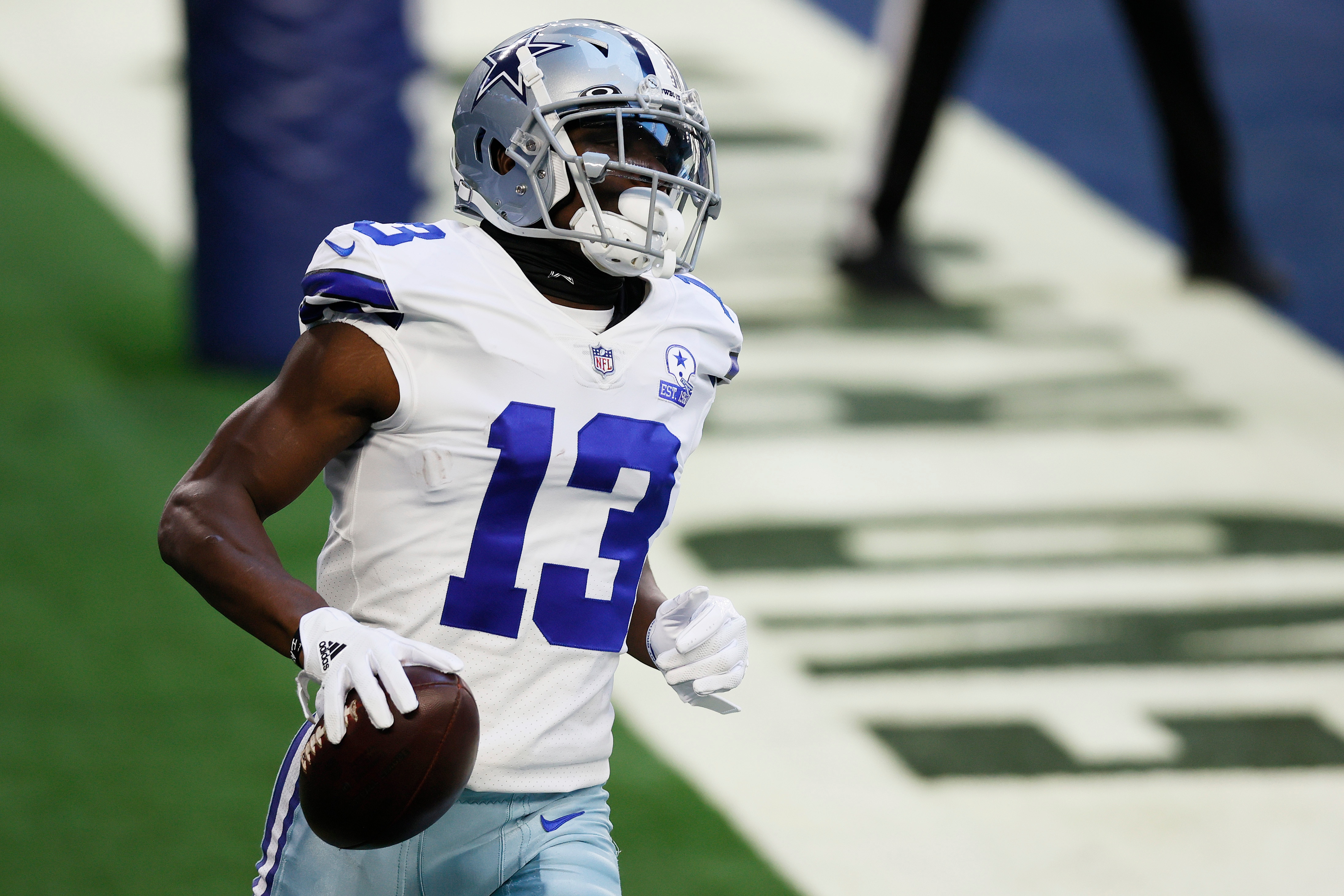 ARLINGTON, TEXAS - DECEMBER 20: Wide receiver Michael Gallup #13 of the Dallas Cowboys celebrates a touchdown against the San Francisco 49ers during the first quarter at AT&T Stadium on December 20, 2020 in Arlington, Texas. (Photo by Tom Pennington/Getty Images)