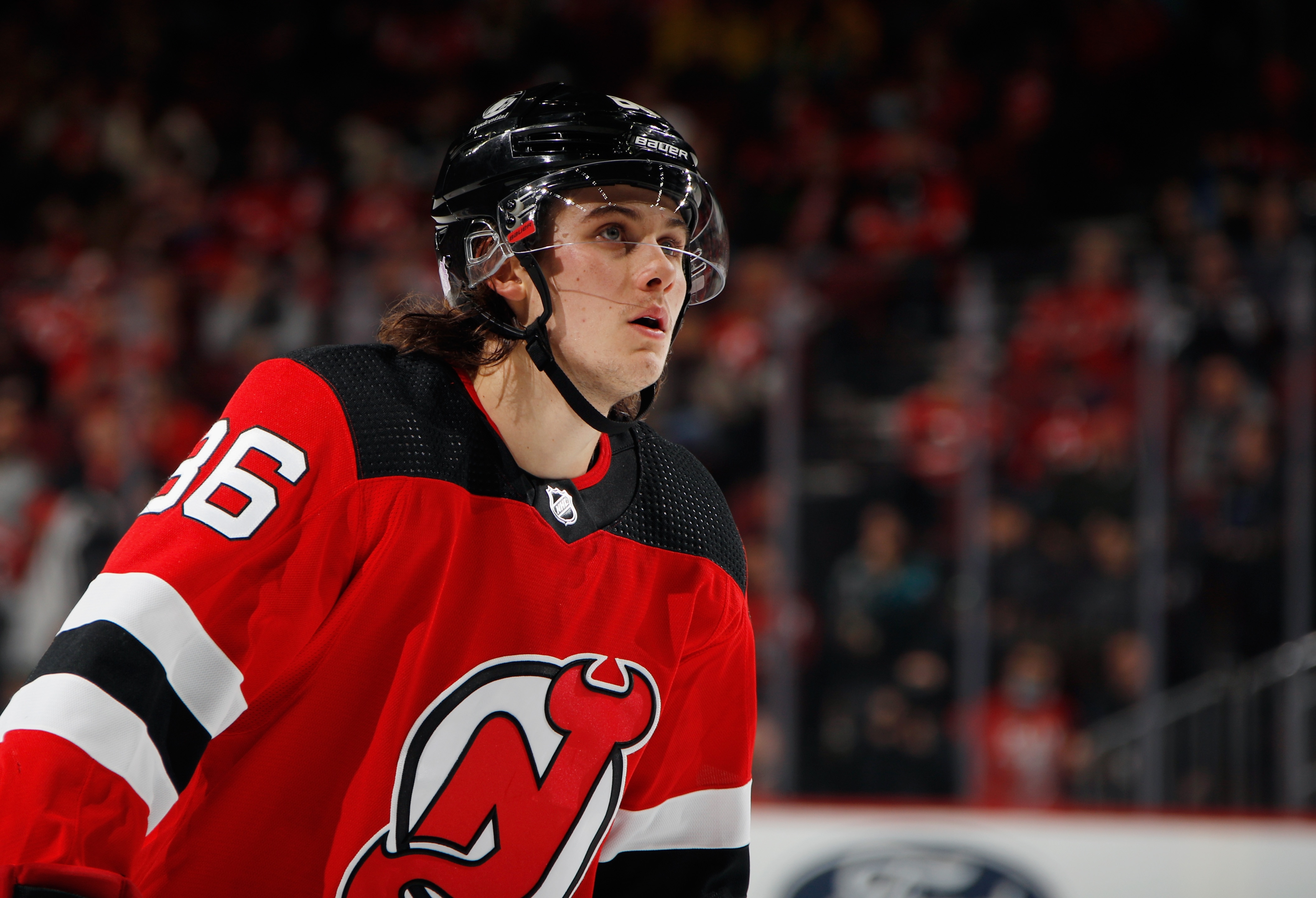 NEWARK, NEW JERSEY - NOVEMBER 30: After signing a contract extension earlier in the day, Jack Hughes #86 of the New Jersey Devils skates against the San Jose Sharks at the Prudential Center on November 30, 2021 in Newark, New Jersey. (Photo by Bruce Bennett/Getty Images)