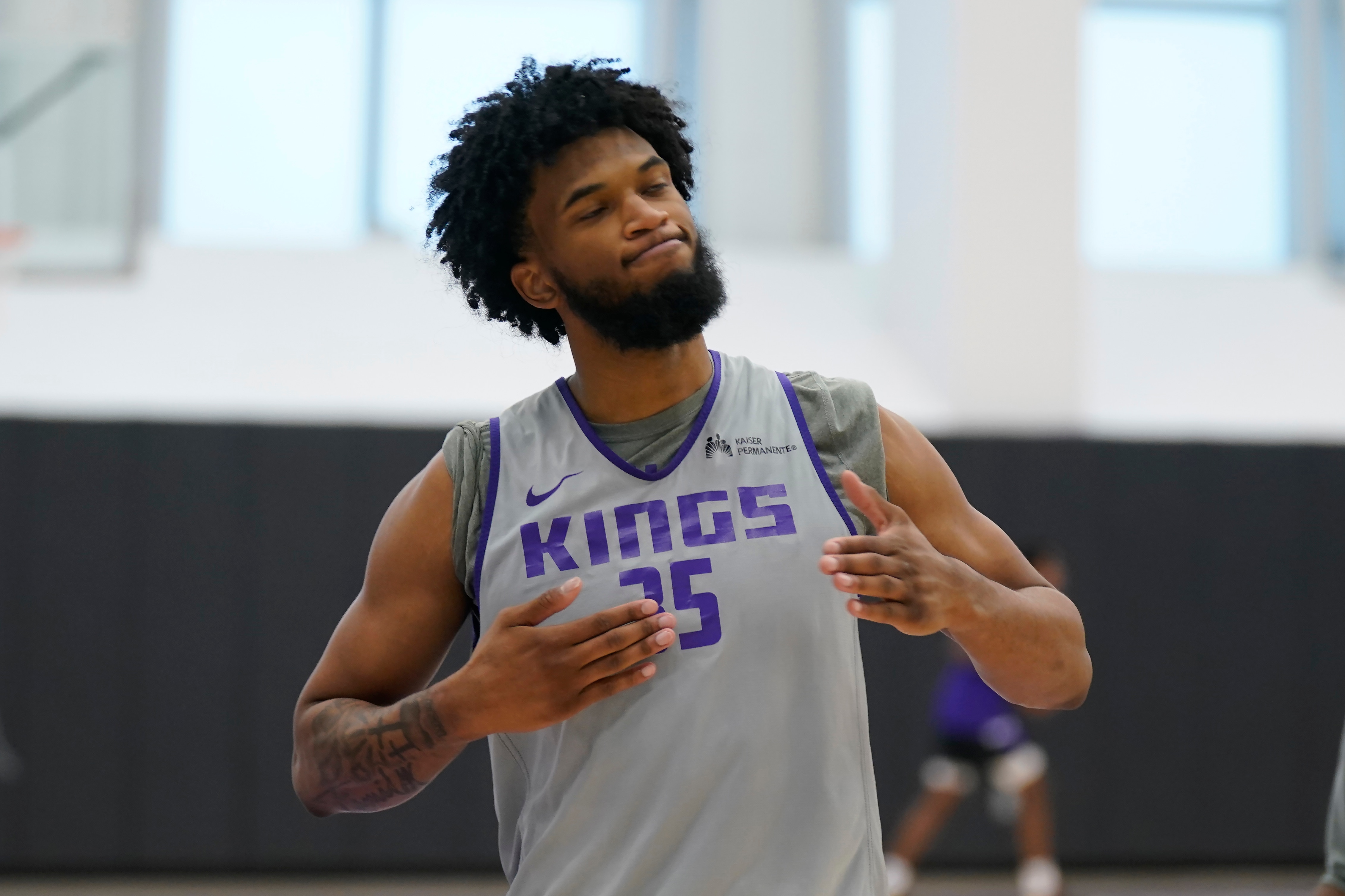 Sacramento Kings forward Marvin Bagley III reacts after making a shot right, during the Kings basketball training camp in Sacramento, Calif., Friday, Oct. 1, 2021. (AP Photo/Rich Pedroncelli)