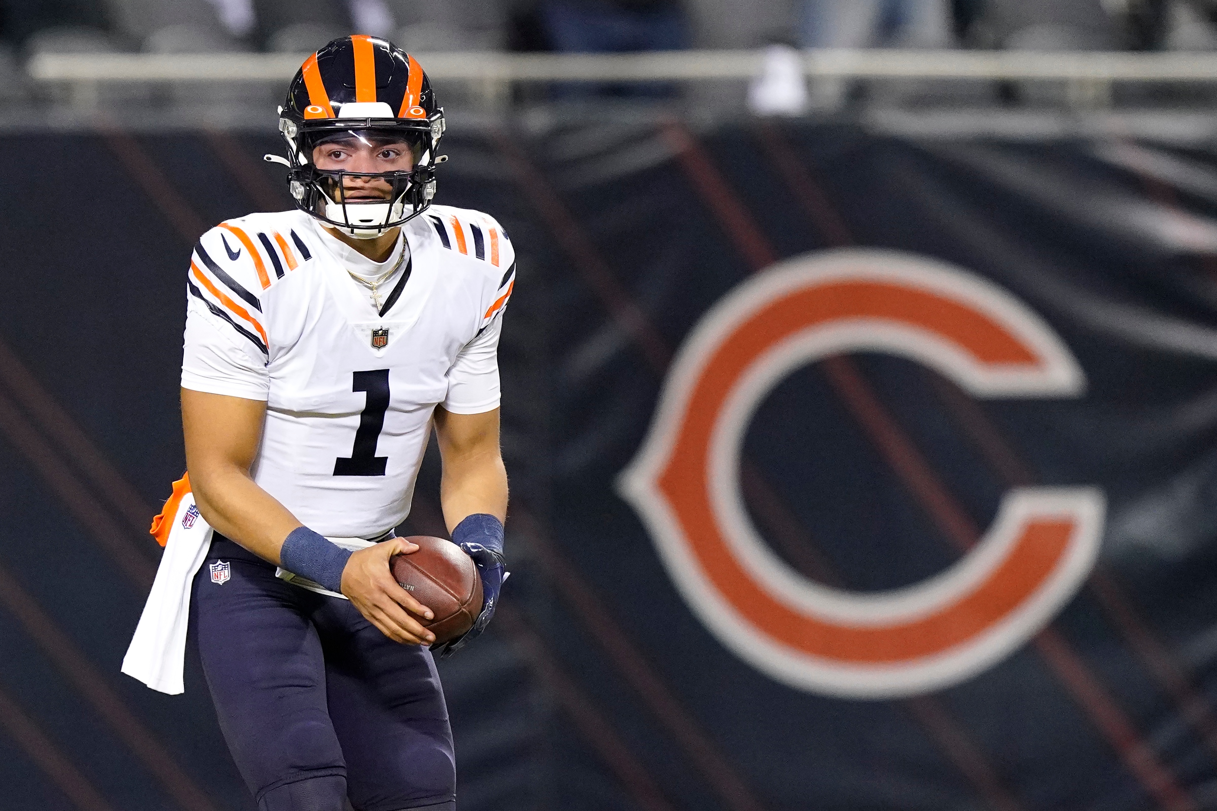 Chicago Bears quarterback Justin Fields warms up before an NFL football game against the Minnesota Vikings Monday, Dec. 20, 2021, in Chicago. (AP Photo/Nam Y. Huh)
