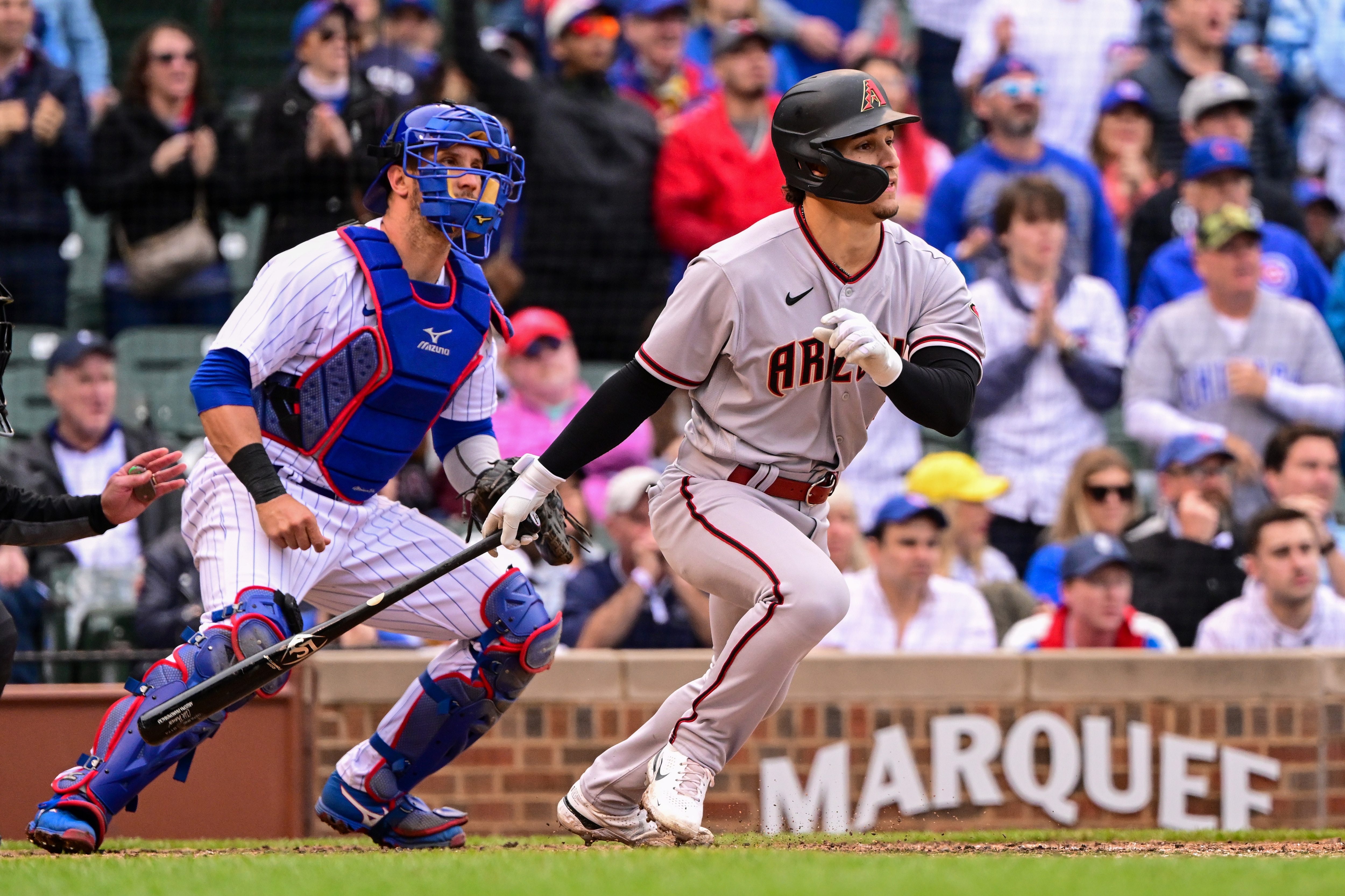 CHICAGO, ILLINOIS - MAY 21: Alek Thomas #5 of the Arizona Diamondbacks his a one run single in the seventh inning against the Chicago Cubs at Wrigley Field on May 21, 2022 in Chicago, Illinois. (Photo by Quinn Harris/Getty Images)