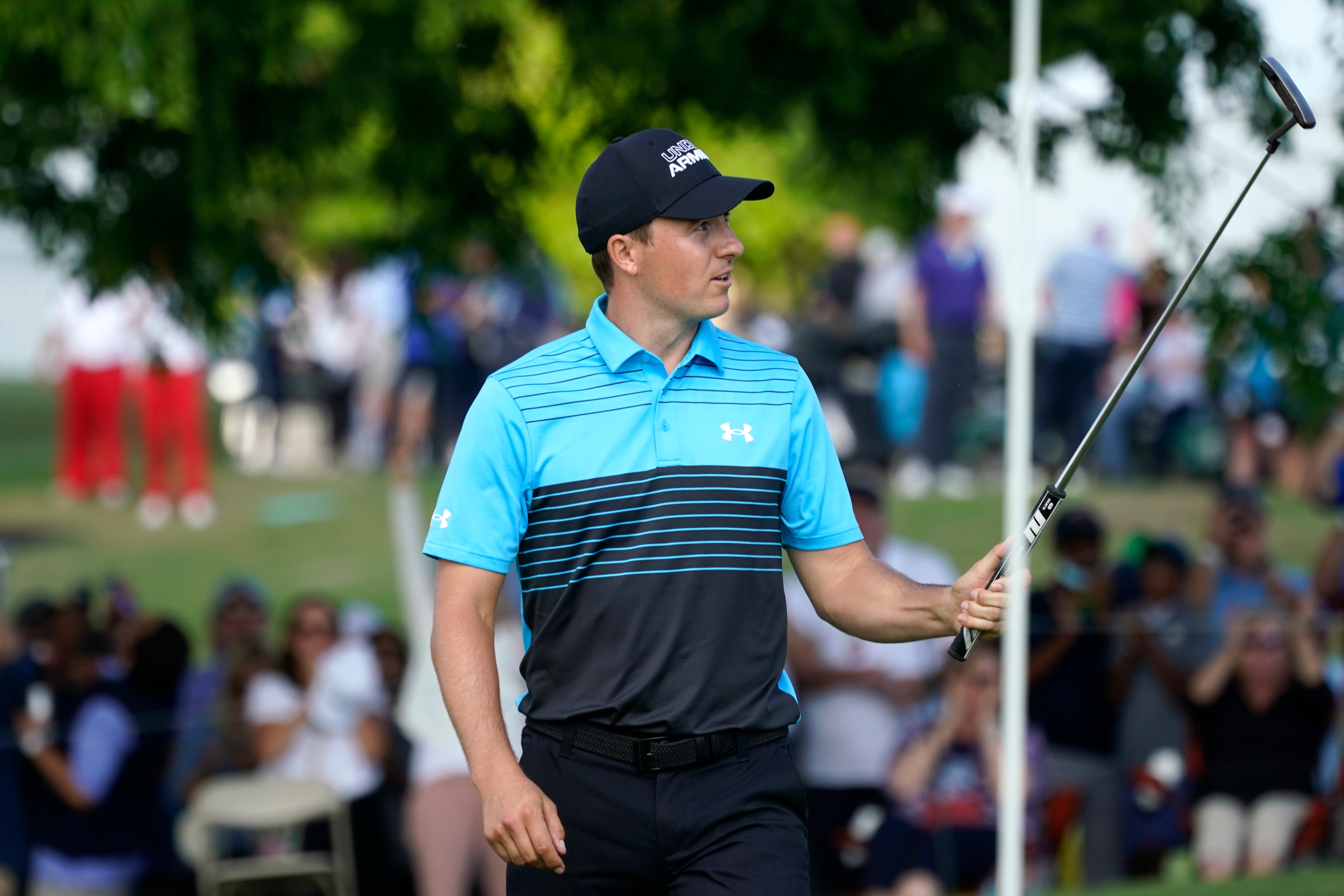 Jordan Spieth reacts after making an eagle putt on the 18th green during the first round of the AT&T Byron Nelson golf tournament, Thursday, May 13, 2021, in McKinney, Texas. (AP Photo/Tony Gutierrez)