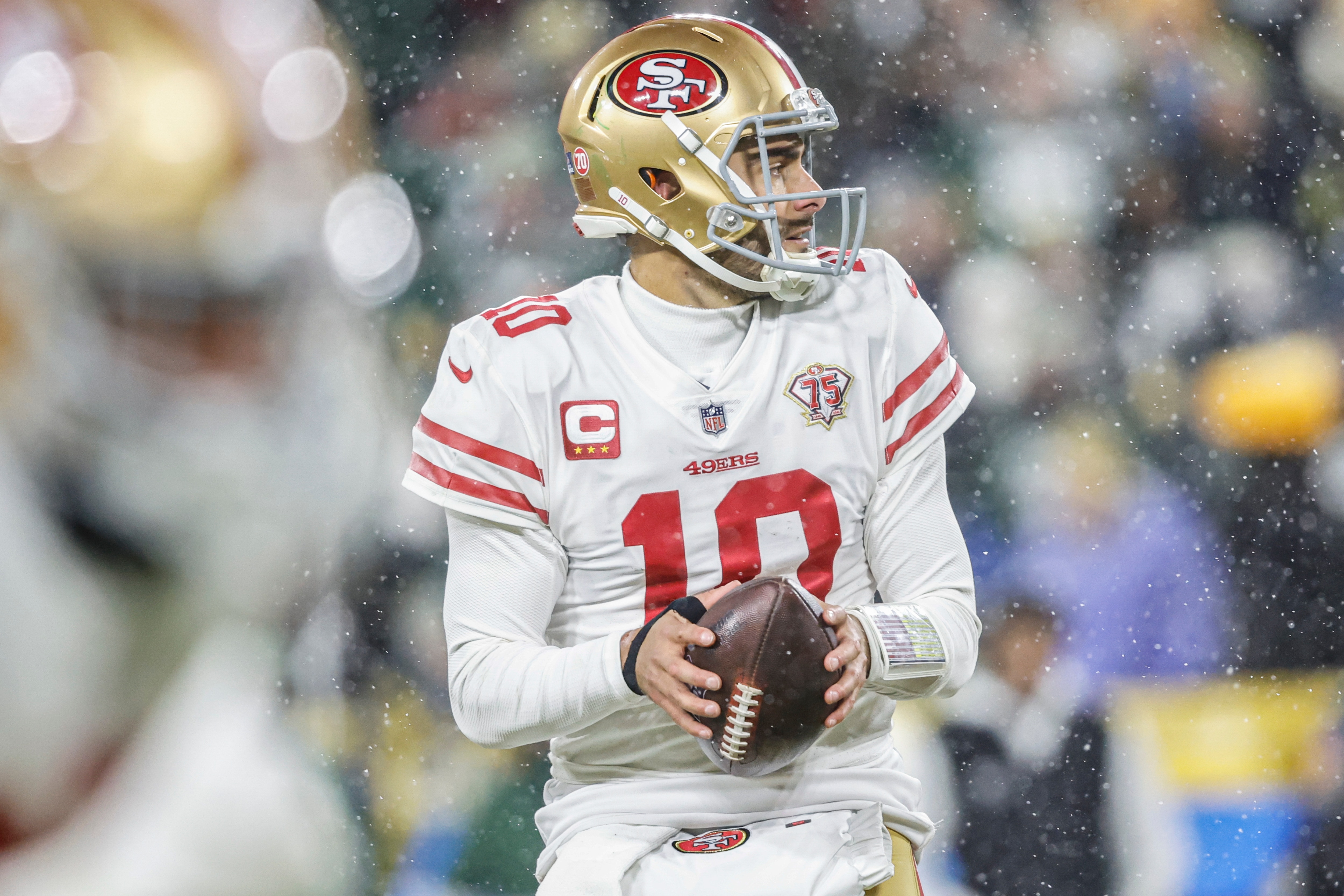 San Francisco 49ers quarterback Jimmy Garoppolo (10) throws the ball during an NFL divisional playoff football game against the Green Bay Packers, Saturday, Jan 22. 2022, in Green Bay, Wis. (AP Photo/Jeffrey Phelps)