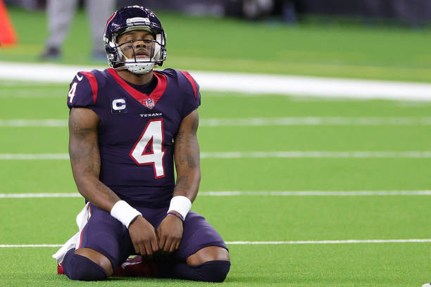HOUSTON, TEXAS - JANUARY 03: Deshaun Watson #4 of the Houston Texans reacts to a play during a game against the Tennessee Titans at NRG Stadium on January 03, 2021 in Houston, Texas. (Photo by Carmen Mandato/Getty Images)