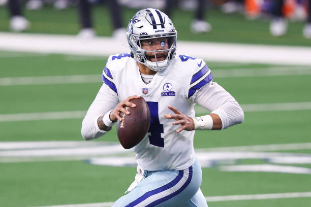 ARLINGTON, TEXAS - OCTOBER 11:  Dak Prescott #4 of the Dallas Cowboys attempts a pass against the New York Giants during the second quarter at AT&T Stadium on October 11, 2020 in Arlington, Texas. (Photo by Tom Pennington/Getty Images)