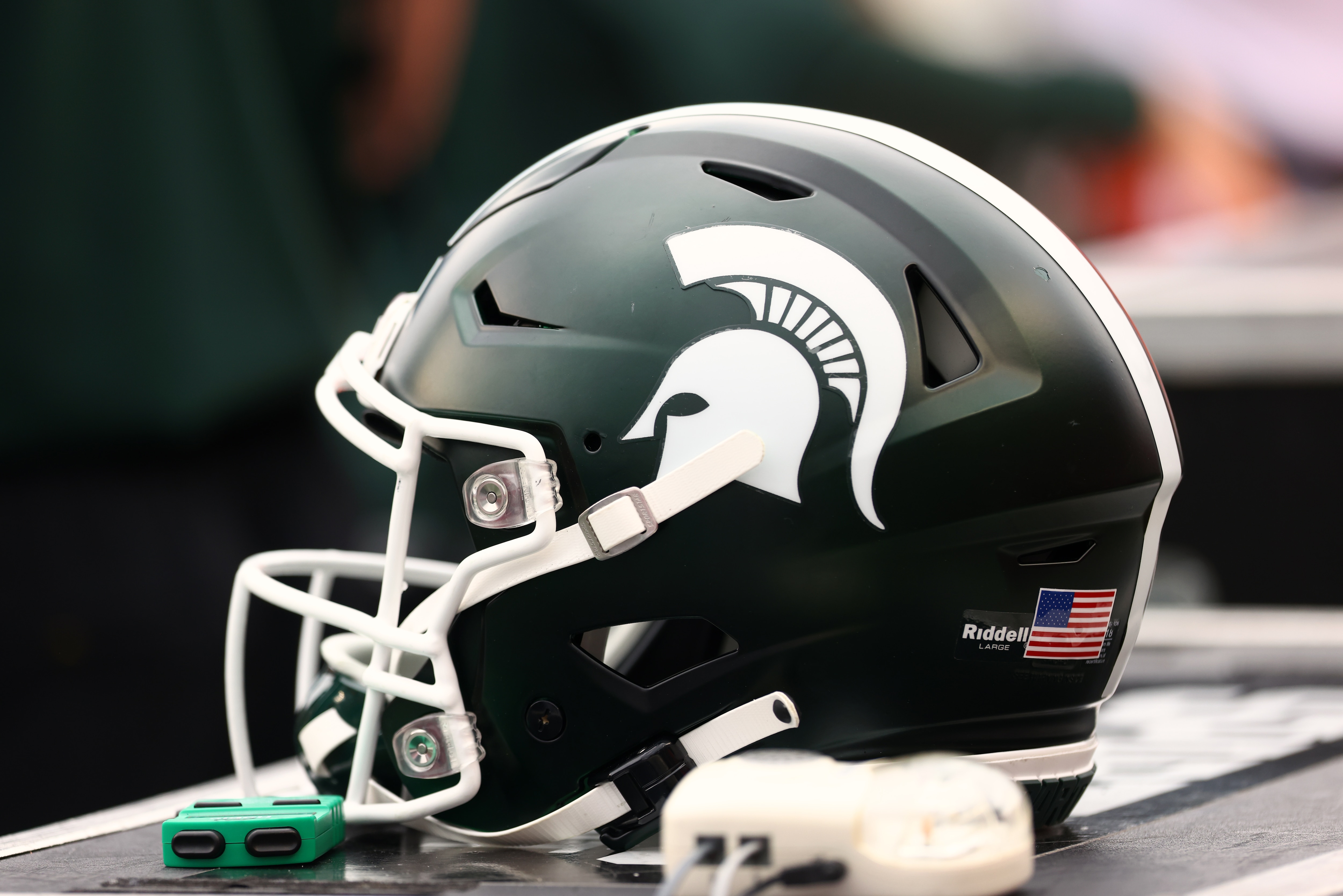 PISCATAWAY, NJ - OCTOBER 09 : A Michigan State Spartans helmet sits on the sidelines during a game against the Rutgers Scarlet Knights at SHI Stadium on October 9, 2021 in Piscataway, New Jersey. Michigan State defeated Rutgers 31-13. (Photo by Rich Schultz/Getty Images)