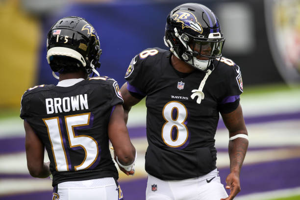 BALTIMORE, MD - NOVEMBER 22: Baltimore Ravens quarterback Lamar Jackson (8) greets Baltimore Ravens wide receiver Marquise Brown (15) before the game between the Tennessee Titans and the Baltimore Ravens on November 22, 2020 at M&T Bank Stadium in Baltimore, Maryland (Photo by Nicole Fridling/Icon Sportswire via Getty Images)