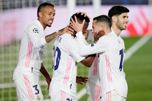 MADRID, SPAIN - APRIL 6: Vinicius Junior of Real Madrid Celebrates 3-1 with Eder Militao of Real Madrid, Lucas Vazquez of Real Madrid, Marco Asensio of Real Madrid  during the UEFA Champions League  match between Real Madrid v Liverpool at the Estadio Alfredo Di Stefano on April 6, 2021 in Madrid Spain (Photo by David S. Bustamante/Soccrates/Getty Images)