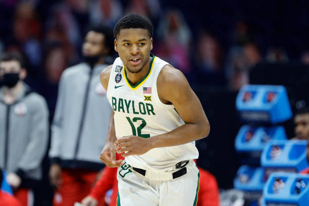 INDIANAPOLIS, INDIANA - APRIL 03: Jared Butler #12 of the Baylor Bears reacts in the first half against the Houston Cougars during the 2021 NCAA Final Four semifinal at Lucas Oil Stadium on April 03, 2021 in Indianapolis, Indiana. (Photo by Tim Nwachukwu/Getty Images)