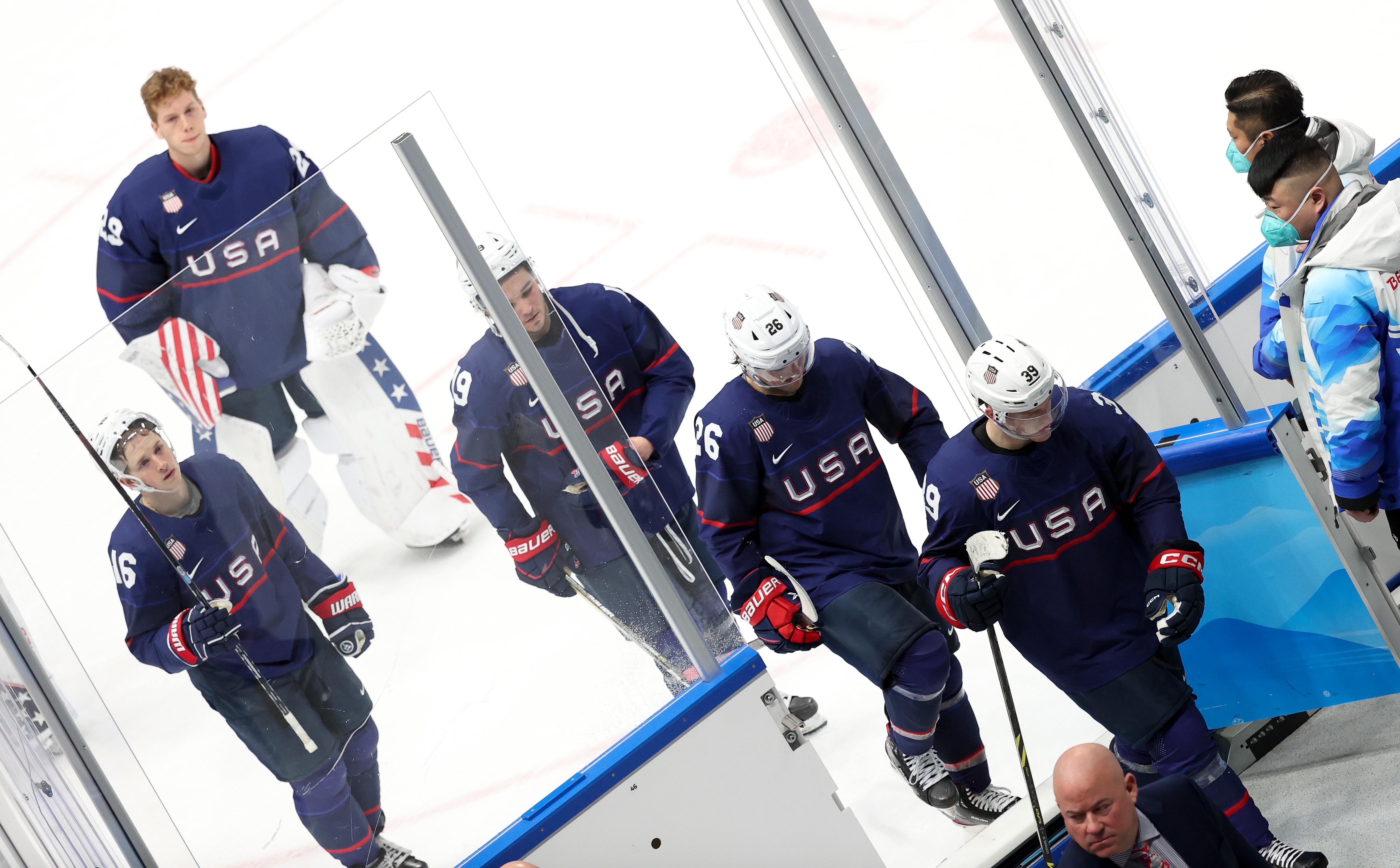 BEIJING, CHINA - FEBRUARY 16: Dejected after losing the match on a penalty shootout, players of Team USA leave the ice following the Men"u2019s Ice Hockey Quarterfinal match between Team United States (USA) and Team Slovakia on Day 12 of the Beijing 2022 Winter Olympic Games at National Indoor Stadium on February 16, 2022 in Beijing, China. (Photo by Jean Catuffe/Getty Images)