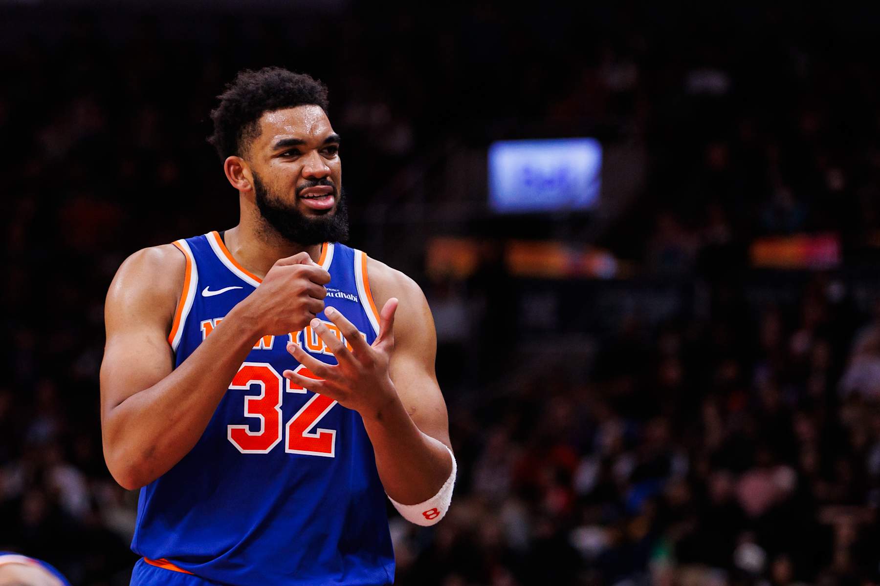 TORONTO, CANADA - DECEMBER 9: Karl-Anthony Towns #32 of the New York Knicks reacts as he walks to the bench during second half of their NBA game against the Toronto Raptors at Scotiabank Arena on December 9, 2024 in Toronto, Canada. NOTE TO USER: User expressly acknowledges and agrees that, by downloading and or using this photograph, User is consenting to the terms and conditions of the Getty Images License Agreement. (Photo by Cole Burston/Getty Images)