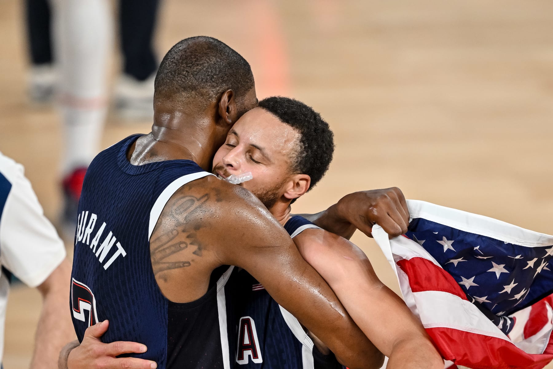 Kevin Durant of USA and Stephen Curry of USA Celebrate the victory and the gold medal during the Men's Basketball Gold Medal match between France and United States of America on Day 15 of the Olympic Games Paris 2024 at Bercy Arena on August 10, 2024 in Paris, France. (Photo by Harry Langer/DeFodi Images via Getty Images)