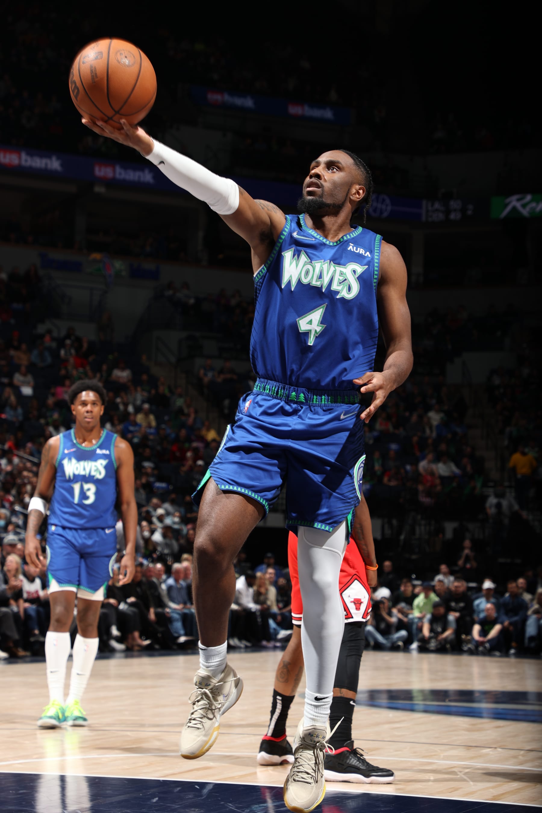 MINNEAPOLIS, MN -  APRIL 10: Jaylen Nowell #4 of the Minnesota Timberwolves drives to the basket during the game against the Chicago Bulls on April 10, 2022 at Target Center in Minneapolis, Minnesota. NOTE TO USER: User expressly acknowledges and agrees that, by downloading and or using this Photograph, user is consenting to the terms and conditions of the Getty Images License Agreement. Mandatory Copyright Notice: Copyright 2022 NBAE (Photo by David Sherman/NBAE via Getty Images)